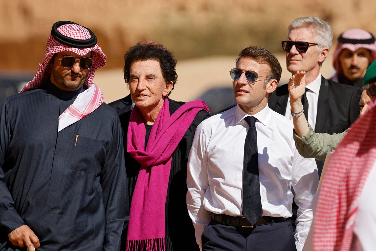 Crossing cultures: Jack Lang, the former French culture minister and head of the Institut du Monde Arabe (wearing scarf), with French president Emmanuel Macron, in Saudi Arabia last year Ludovic Marin/Pool/AFP via Getty Images