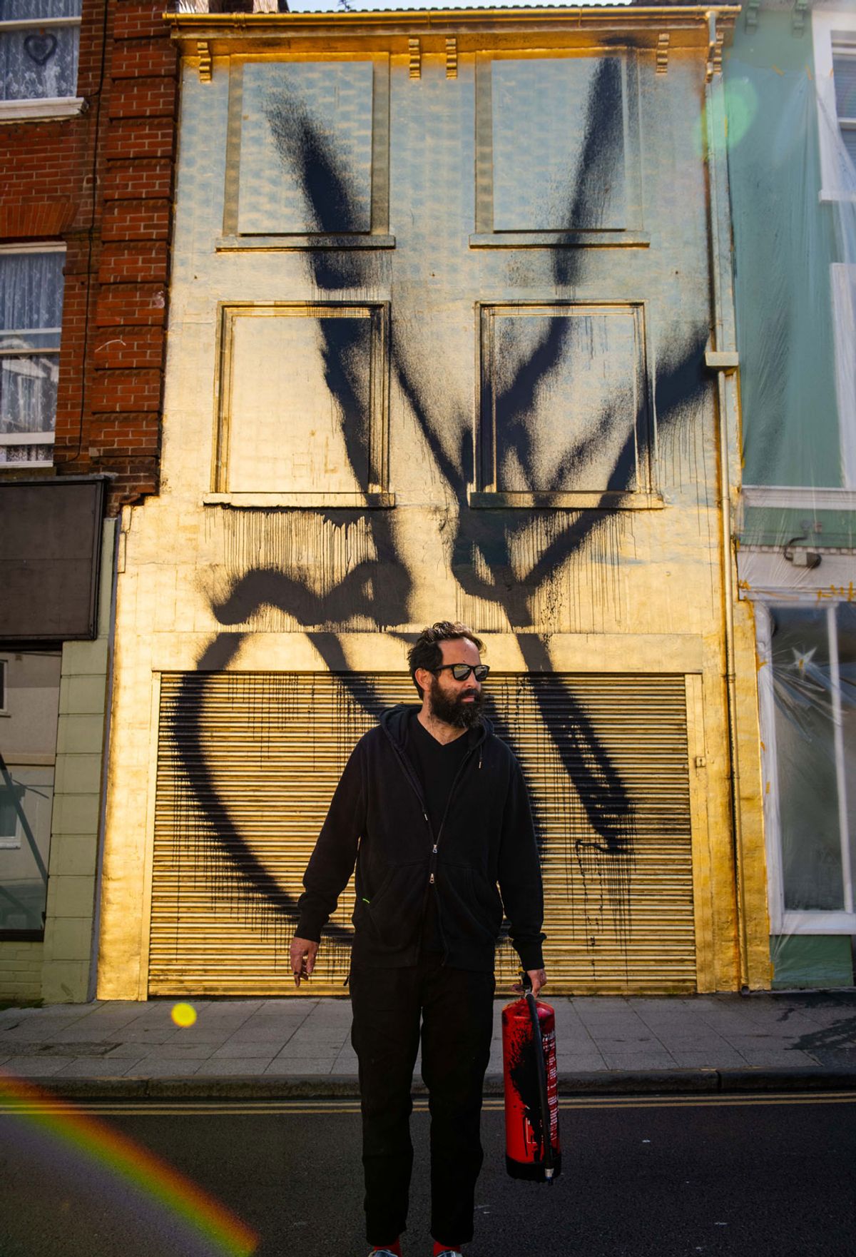 Stefan Brüggemann in front of his new public work OK (Untitled Action) in Folkestone Courtesy of PA , Stefan Brüggemann, 2020