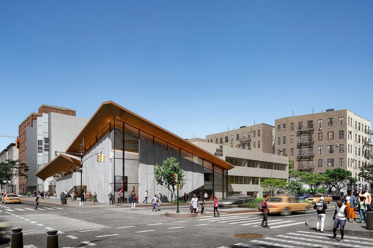 A render of the Grand Concourse entrance of The Bronx Museum’s South Wing, which aims to better connect to the community and shows a sloped, geometric roof and a glass façade that works with the adjacent origami-like building
Courtesy of Marvel
