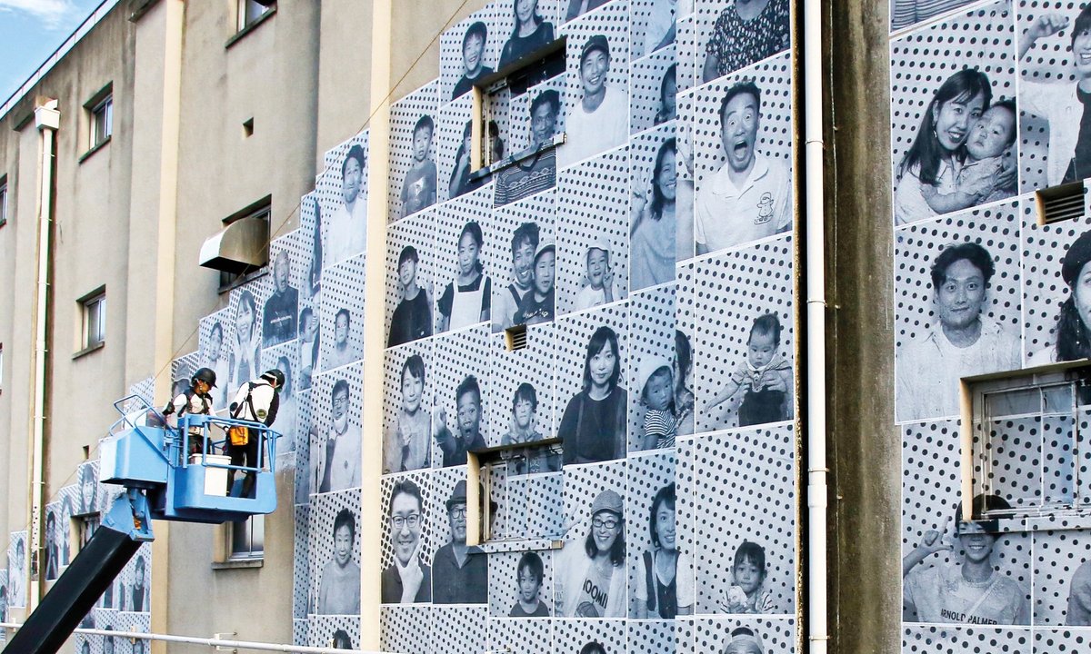 Faces of refugees and locals to be pasted on Geneva constructing as a part of JR images challenge Faces of refugees and locals to be pasted on Geneva constructing as a part of JR images challenge