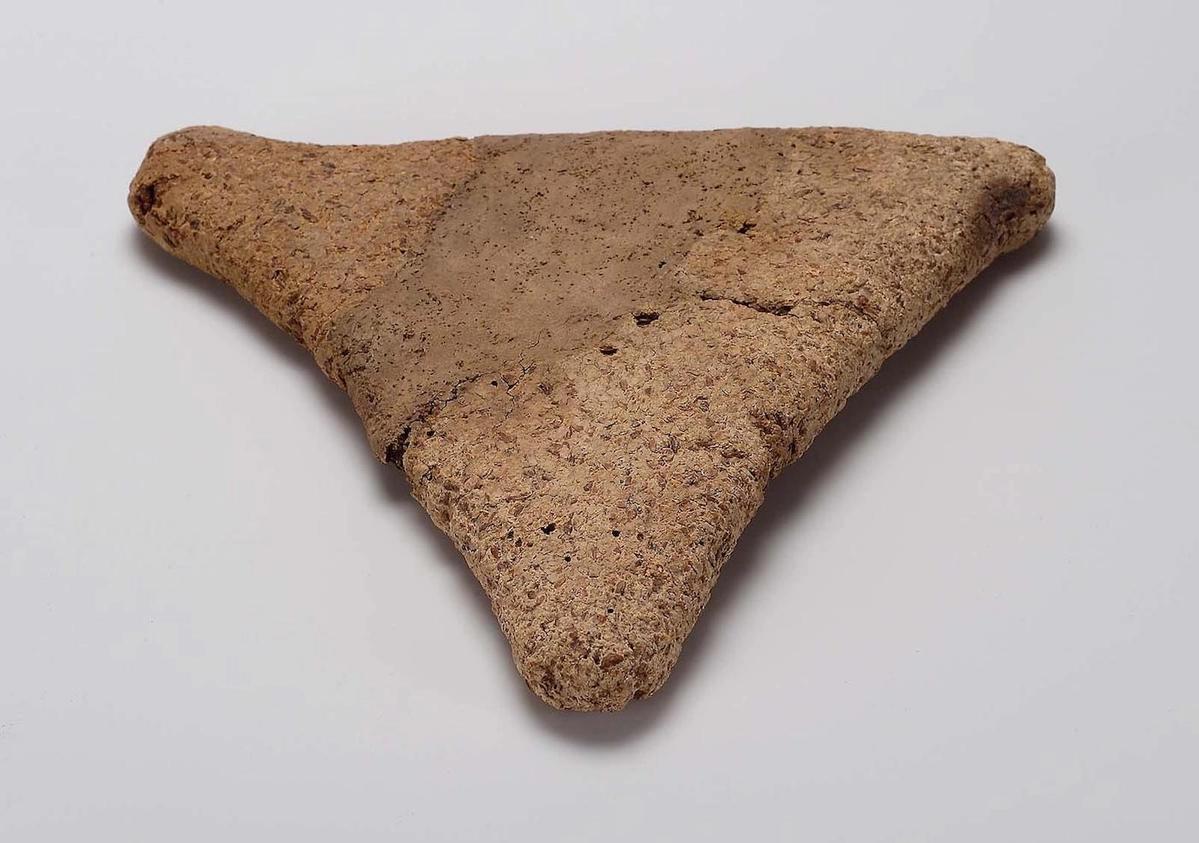 A triangular loaf of bread found in Thebes in a foundation deposit dating to the Egyptian Middle Kingdom, 2010–1998 BC Museum of Fine Arts, Boston