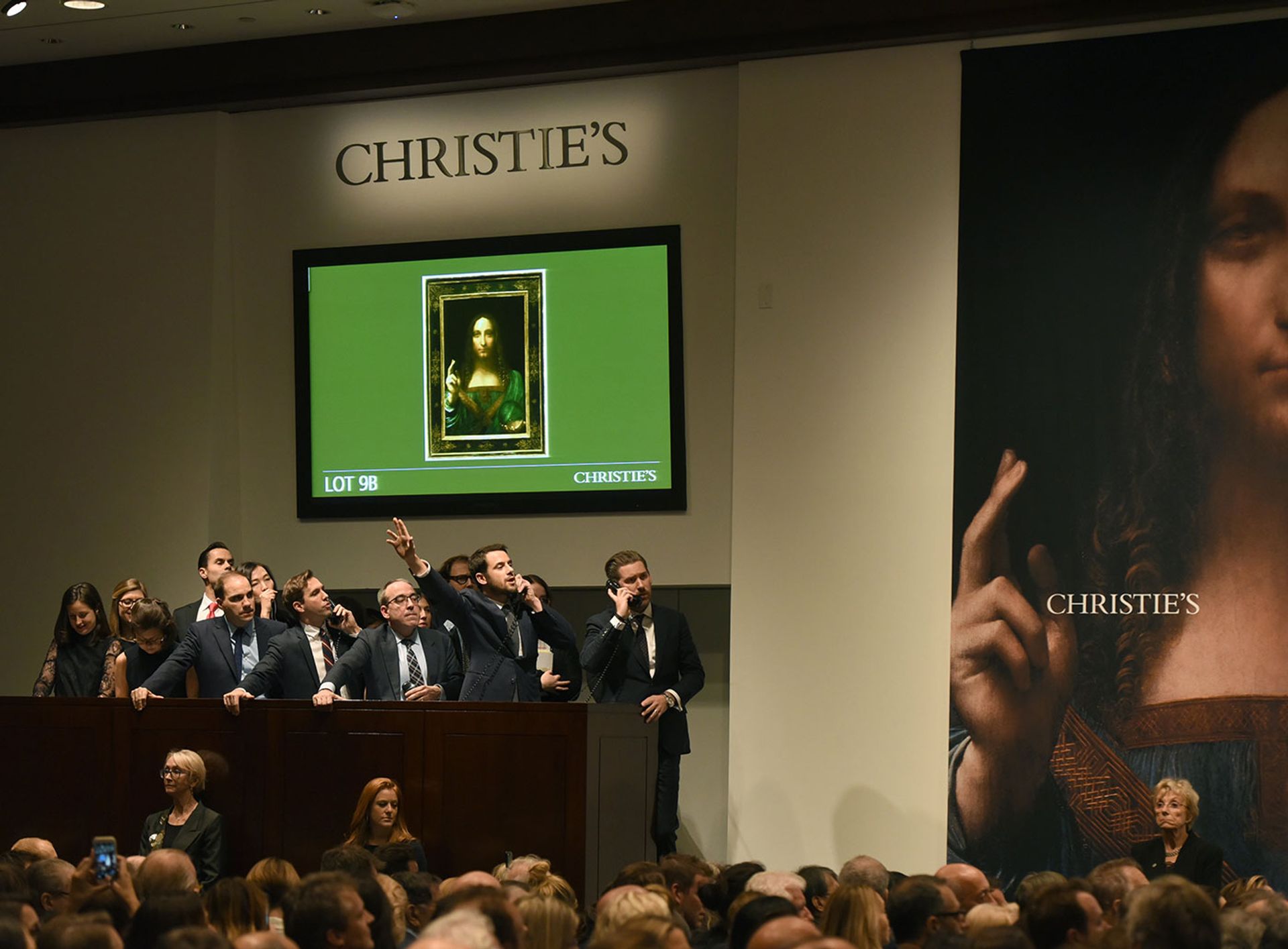 The 18-minute sale of the $450.3m Salvator Mundi in progress at Christie's, New York, on 15 November 2017 Timothy A. Clary/AFP via Getty Images