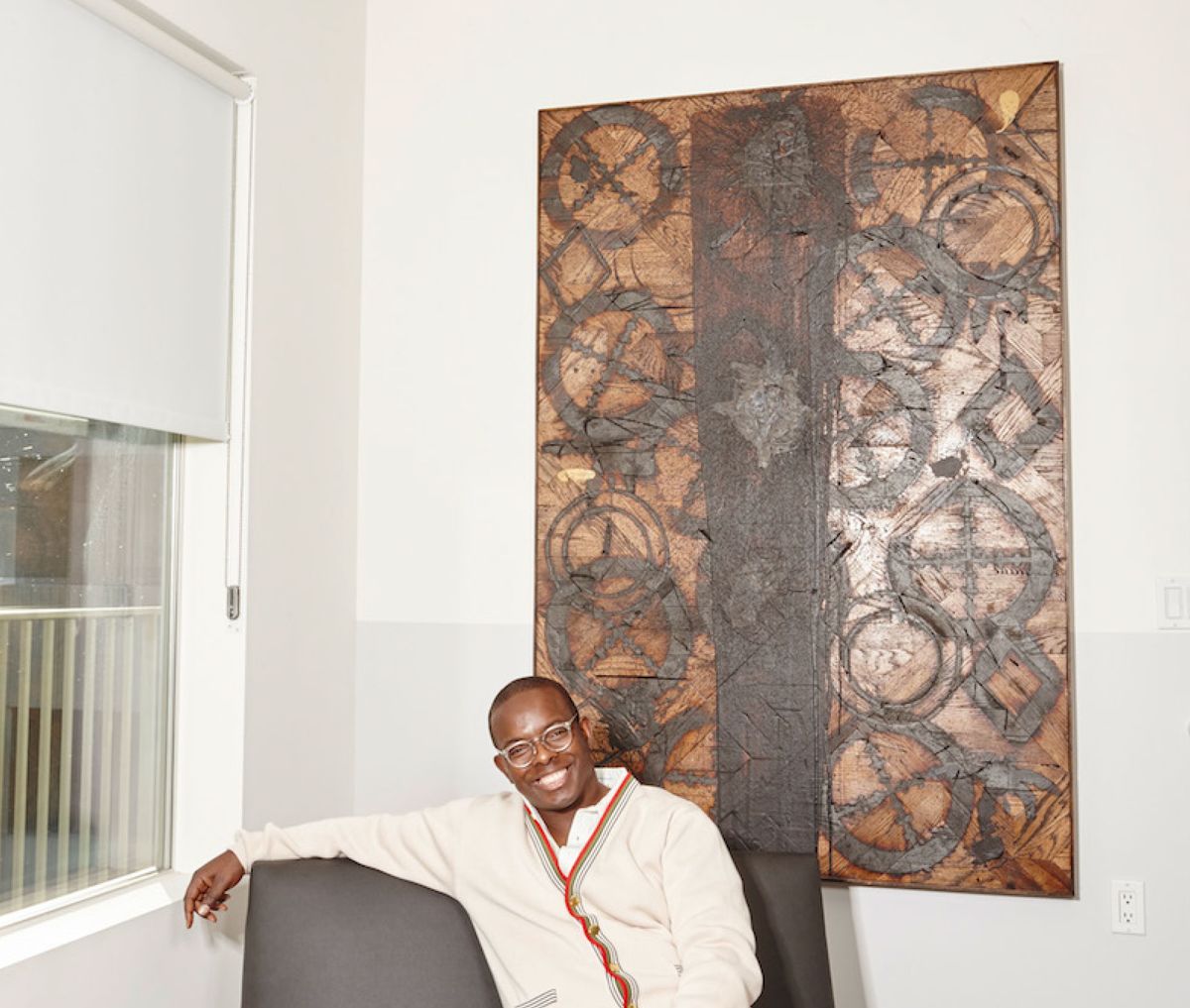 George Wells with a work by Rashid Johnson from his collection Photo: Ben Duggan / LotLine