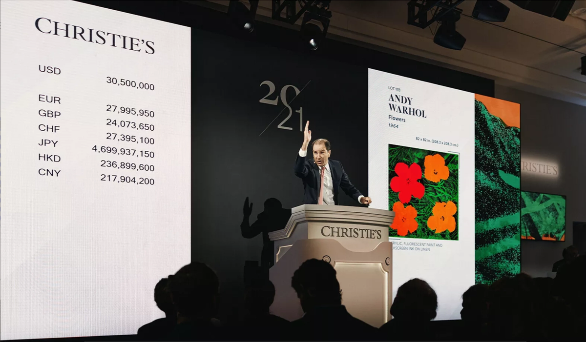 Christie’s global head of private sales, Adrien Meyer, selling the top lot of the house's Modern art evening auction last night, Andy Warhol’s Flowers (1964)