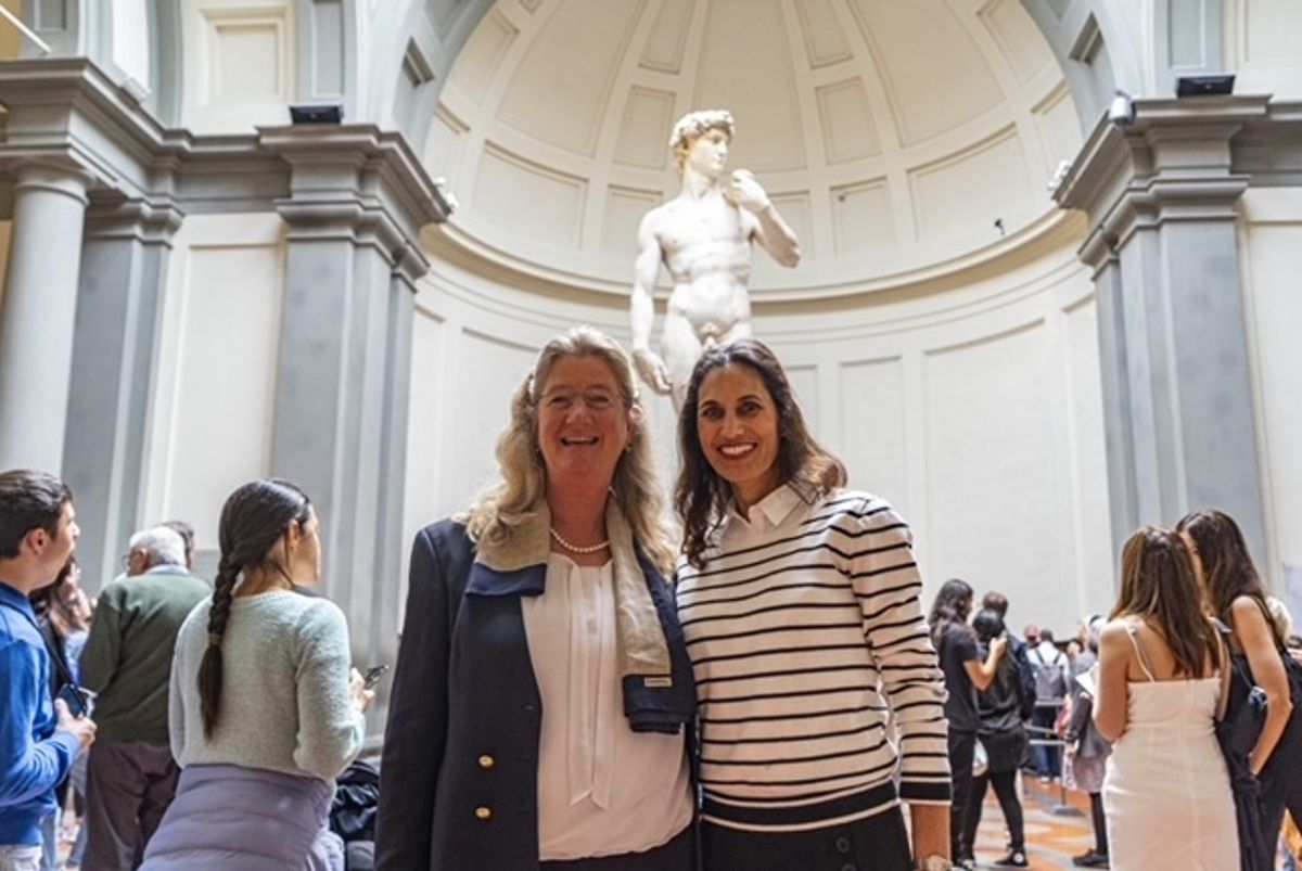 Florida educator Hope Carrasquilla (right) and Galleria del'Accademia director Cecilie Hollberg (left) with the statue of David Guido Cozzi
