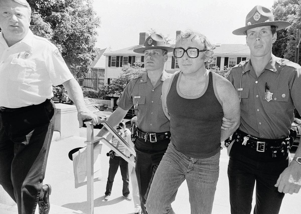 Myles Connor with police officers after being arrested in July 1985 AP Photo/Jim MacMillan