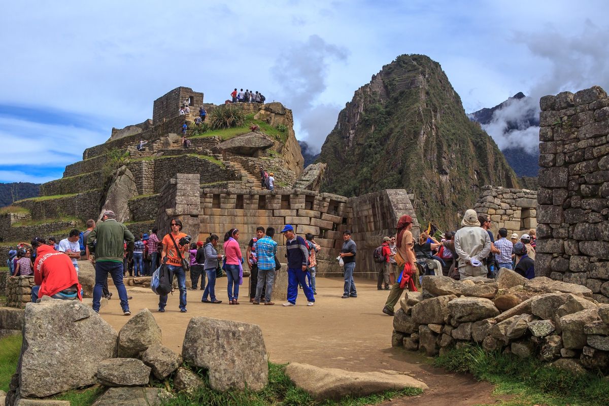 Visitors at Machu Picchu in Peru Photo by Murray Foubister, via Wikimedia Commons