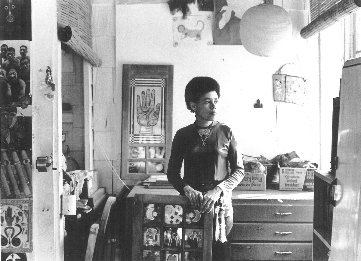 Betye Saar holding Black Girl’s Window at her Laurel Canyon Studio, Los Angeles, California, 1970 Courtesy of the artist and Roberts Projects, Los Angeles, California, Photo Bob Nakamura. © 2019 Betye Saar, courtesy the artist and Robert Projects, Los Angeles