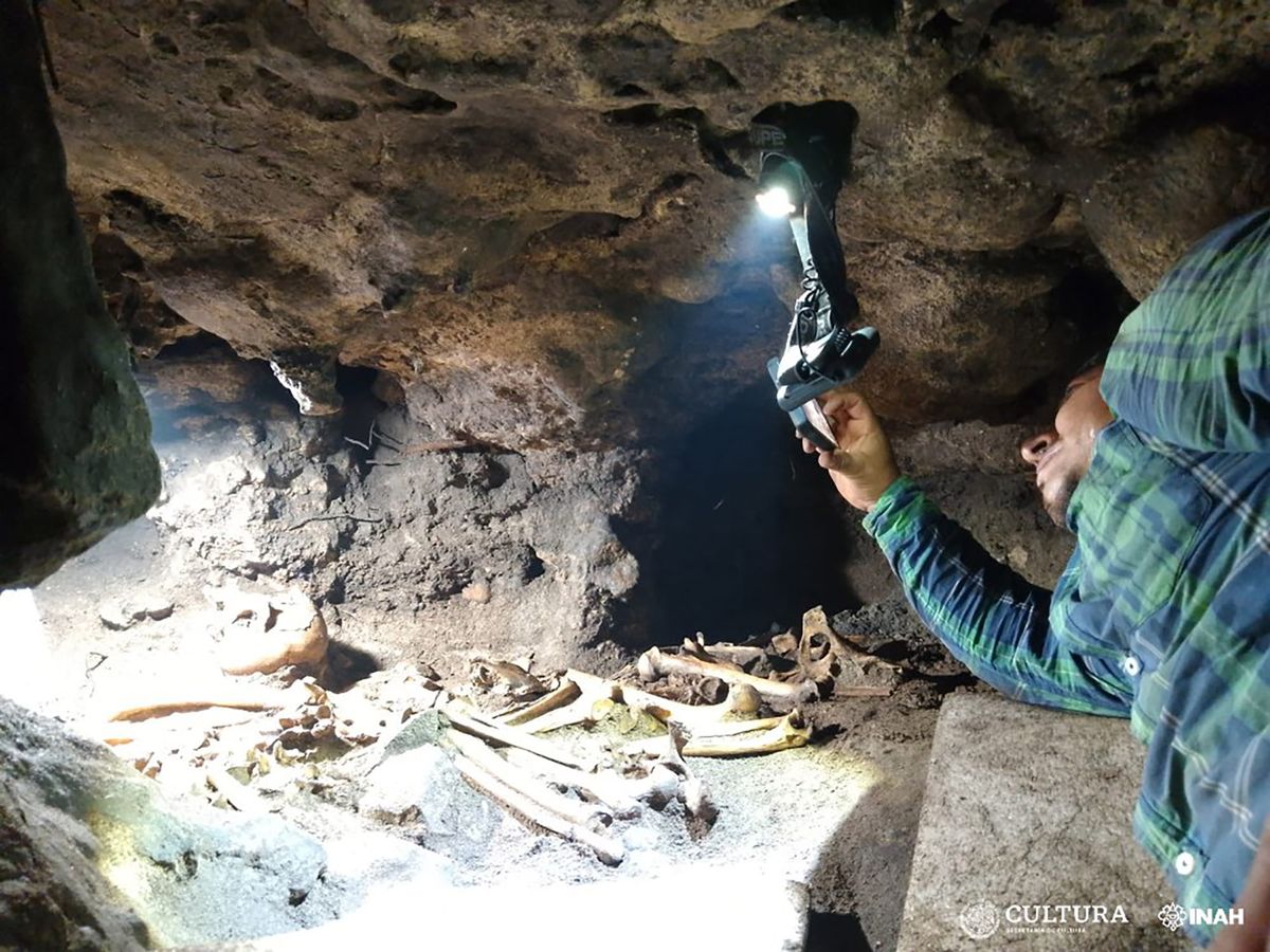 An archaeologist inside the newly discovered burial site at Tulum Courtesy National Institute of Anthropology and History (INAH)