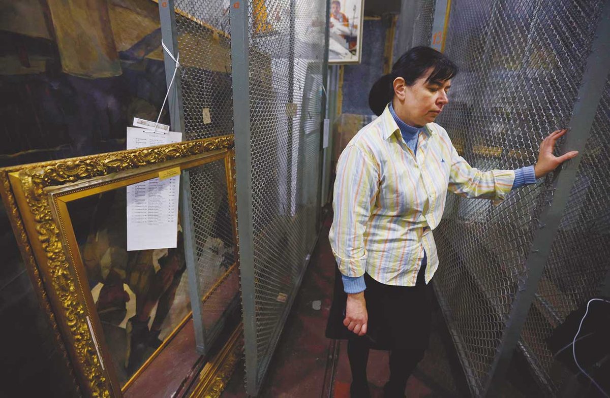 The deputy director in the storeroom of the Kherson Regional Art Museum after the works were seized Photo: Newscom/Alamy Live News