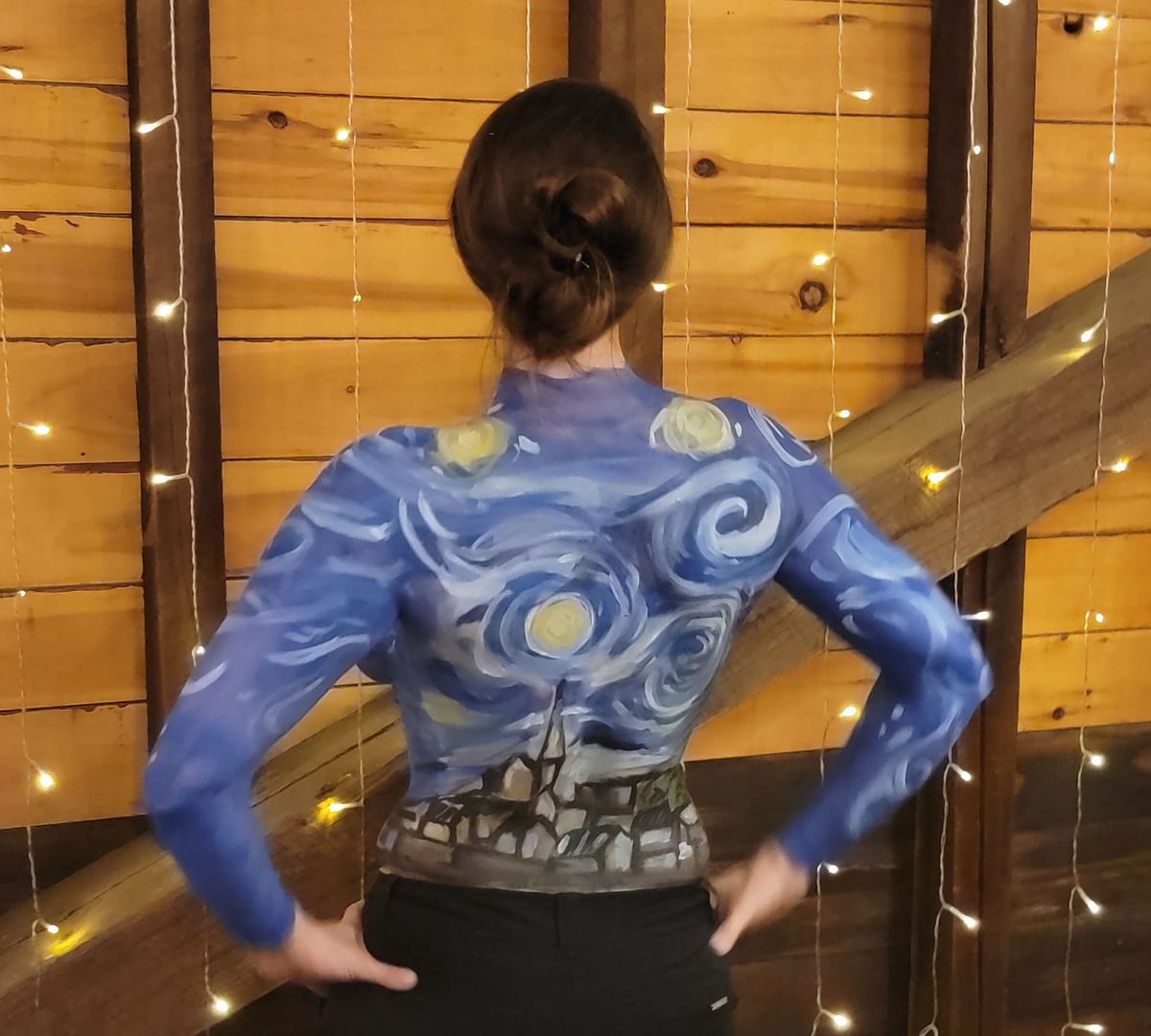 A model whose body was painted by artist Leon Rainbow in the style of Van Gogh's Starry Night at a hospital fundraiser Courtesy Leon Rainbow