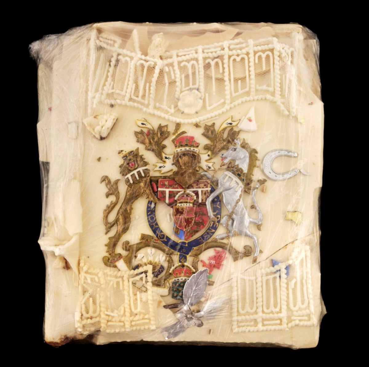 The slice of cake icing with the Royal Coat-of-Arms from the wedding of Prince Charles and Lady Diana Spencer in 1981 Courtesy of Dominic Winter Auctioneers