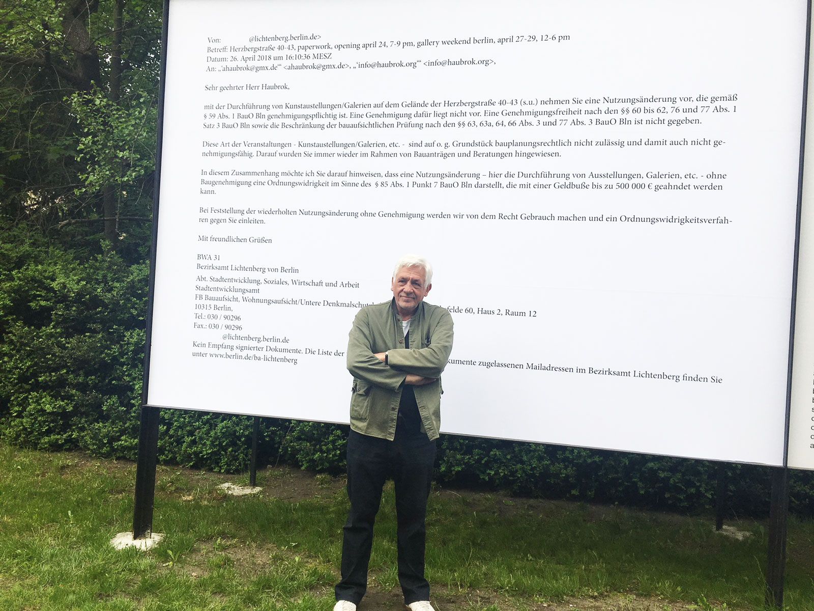 The collector Axel Haubrok in front of a giant copy of the email he received from the local authority saying his exhibition space is violating zoning laws Catherine Hickley