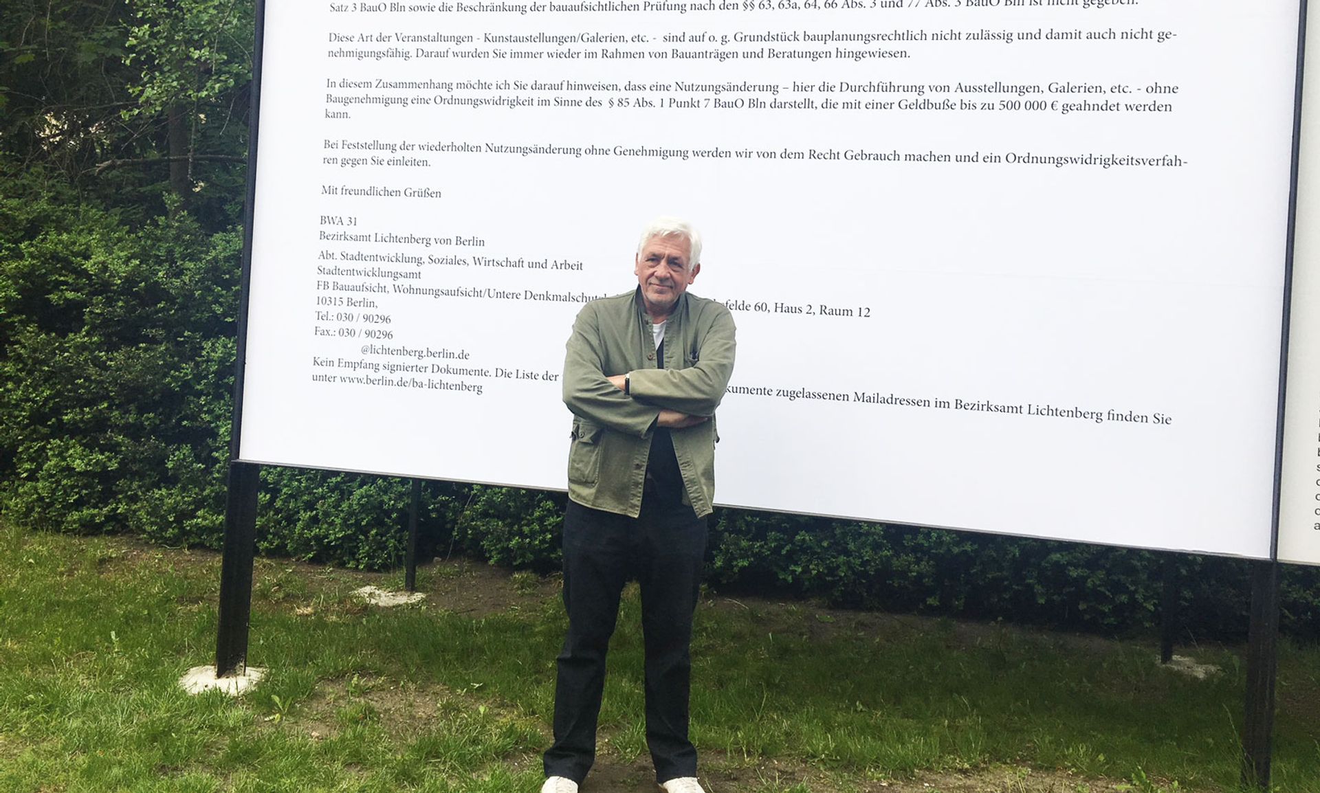 The collector Axel Haubrok in front of a giant copy of the email he received from the local authority saying his exhibition space is violating zoning laws Catherine Hickley