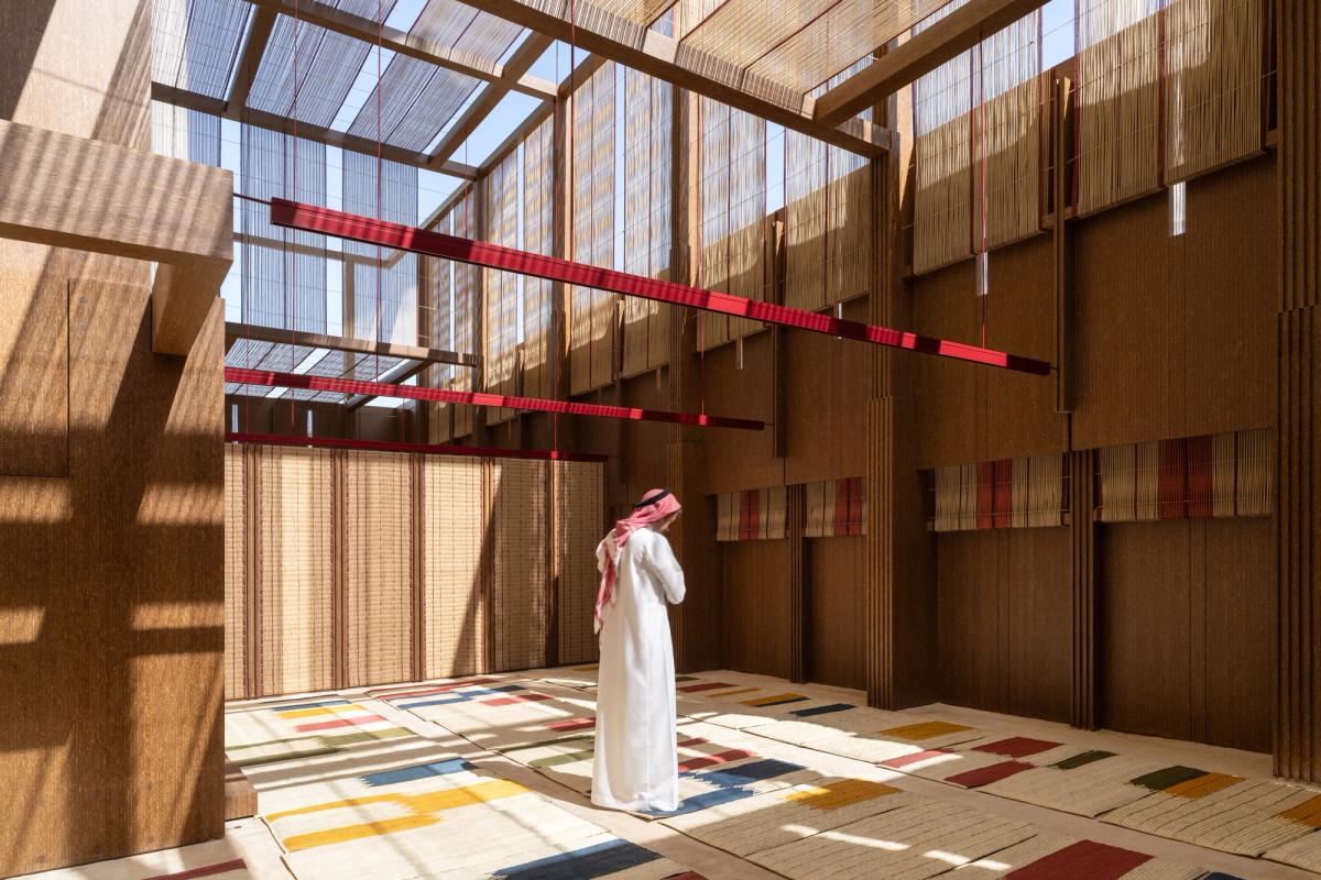 A visitor to the AlMusalla at the 2025 Islamic Arts Biennale Photo by Marco Cappelletti, courtesy of the Diriyah Biennale Foundation