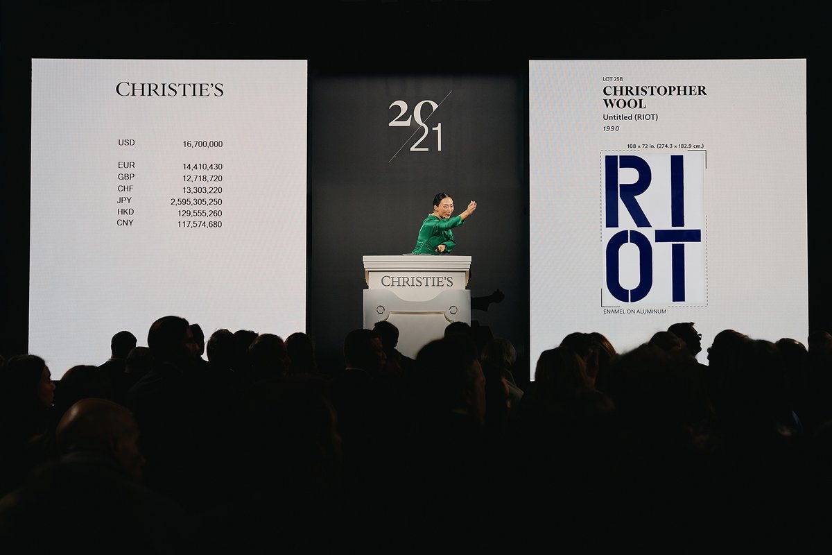 Auctioneer Yü-Ge Wang sells Christopher Wool's Untitled (Riot) (1990) at Christie's 21st century evening sale
Courtesy of Christie's