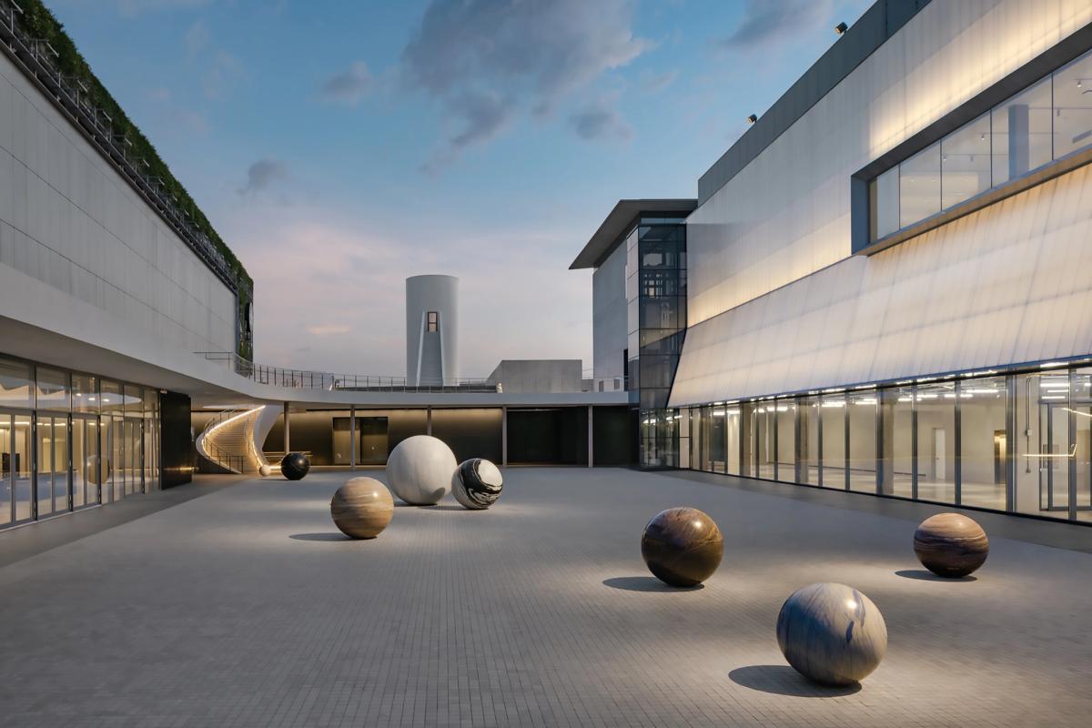 The entry court of Dib Bangkok hosts an outdoor installation of stone spheres by artist Alicja Kwade 
Photo by W. Works, Courtesy of Dib Bangkok