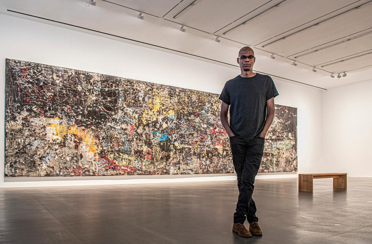 Mark Bradford at Hauser & Wirth London; in front of his work Cerberus (2018) Photo: Sim Canetty- Clark. Courtesy the artist and Hauser & Wirth