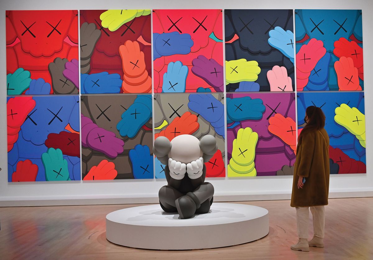 X-offender: a group of prints from KAWS’s Urge series, and a sculpture, Separated, in the Brooklyn Museum show Photo by ANGELA WEISS/AFP via Getty Images; works © kaws
