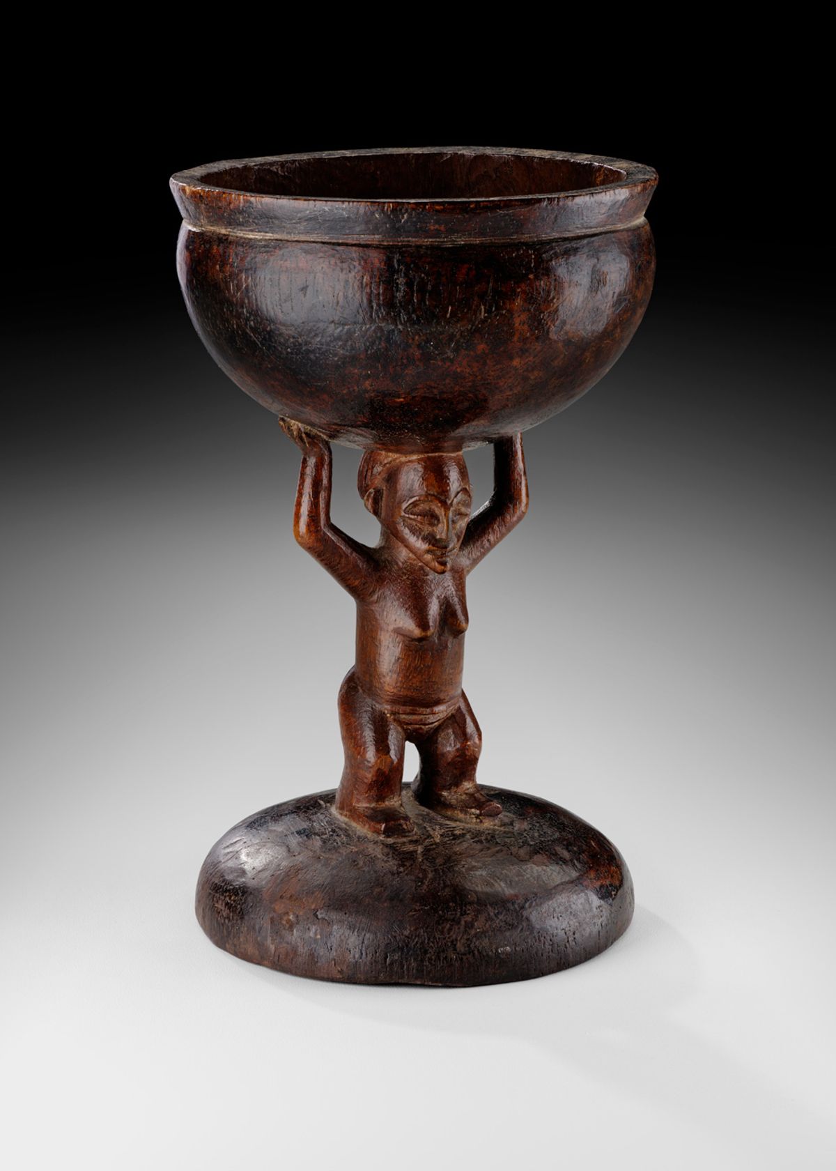 A decorative bowl mounted on a carving of a woman, one of the six works returned to the Angolan government courtesy of the Sindika Dokolo Foundation