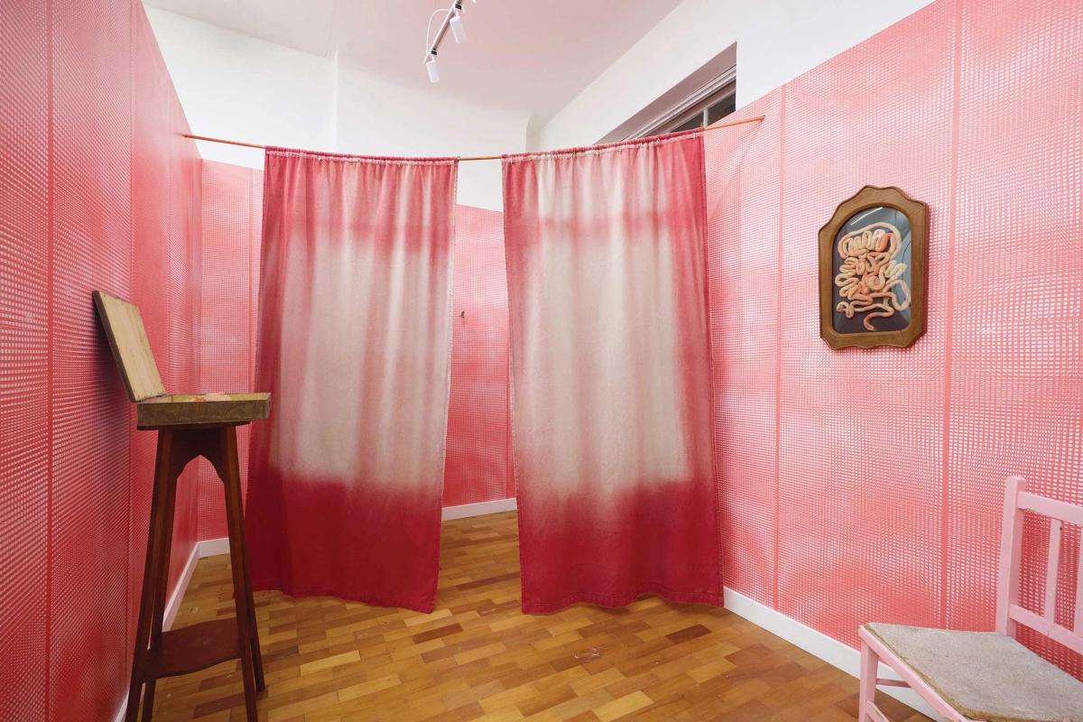 Alice Black's stand at Echo Soho features Rachael Louise Bailey’s In-habit (2025), which includes wallpaper designed from washed-up plastic oyster sacks and a vitrine of intestines
Photo: Tom Carter Photography; courtesy of the gallery and artist