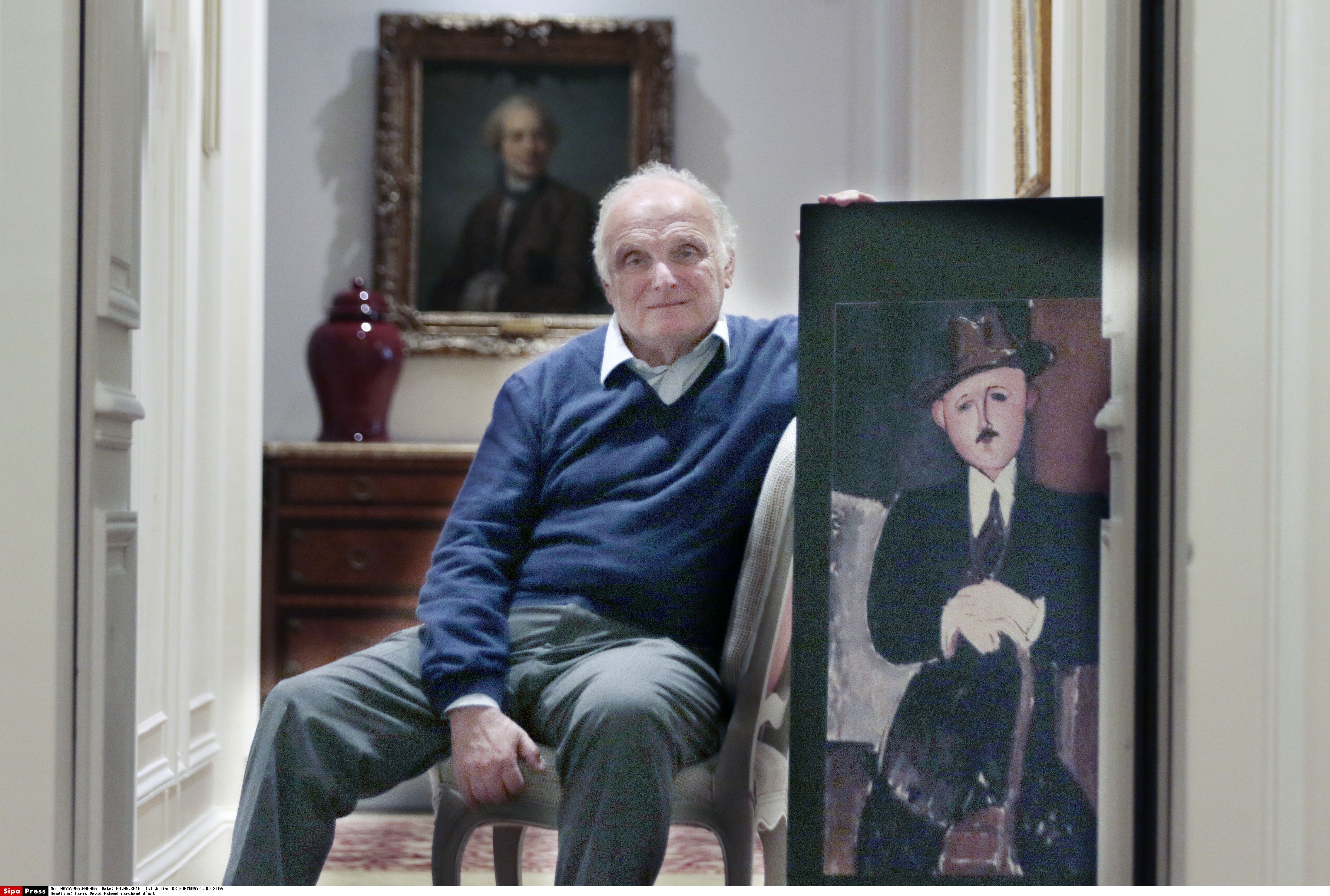 The art dealer David Nahmad with the painting by Modigliani Sipa via AP Images
