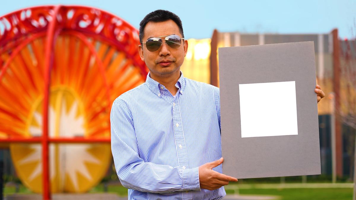 Professor Xiulin Ruan with the "whitest-white" paint Courtesy of Purdue University