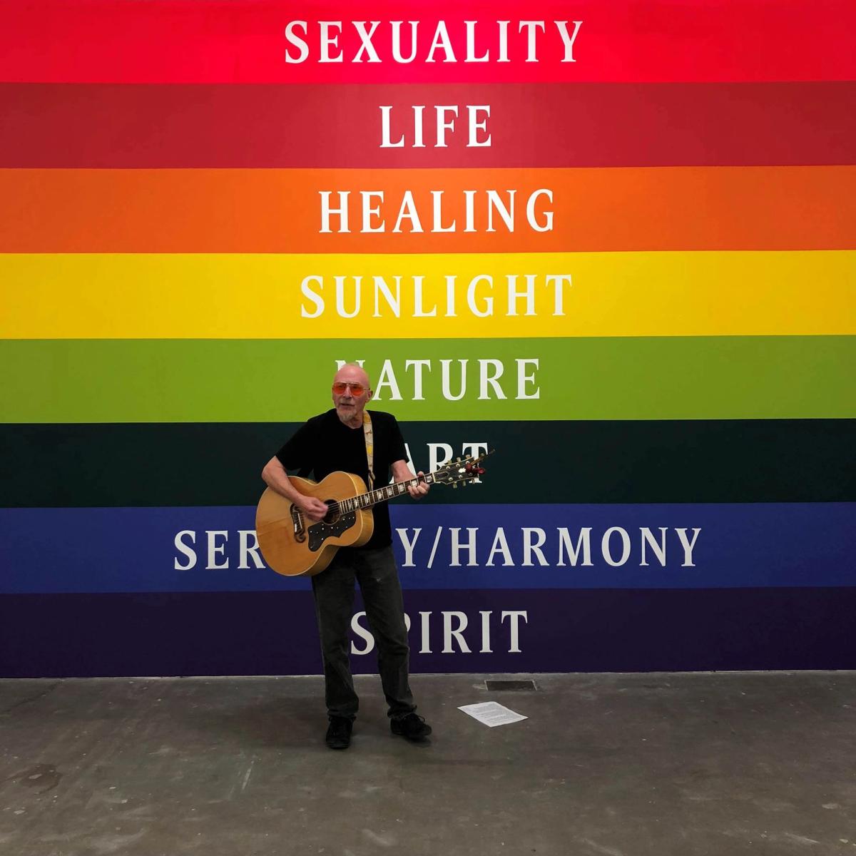Graham Parker performing at Ikon during the opening of Polly Apfelbaum's exhibition Waiting for the UFOs (a space set between a landscape and a bunch of flowers) 