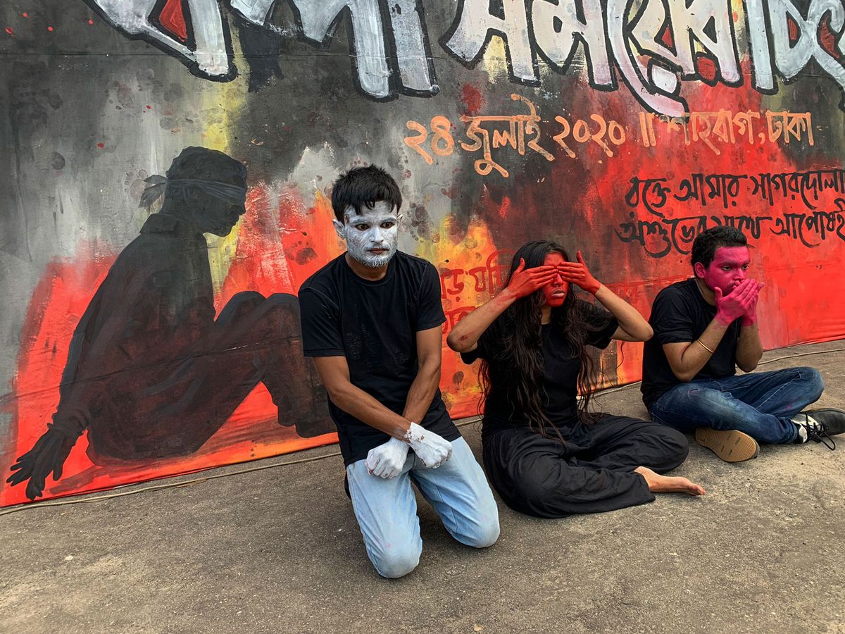 Shahidul Alam's photograph titled Sohan Mahmud, Humaira Fehrooz and Khuddho Ganguly protest against Digital Security Act is included in Prix Pictet, Confinement © Shahidul Alam
