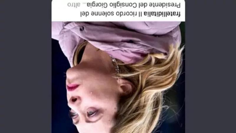 The inverted images have been interpreted as a reference to Mussolini's corpse hung in Milan's Piazzale Loreto after Italian partisans executed him in 1945