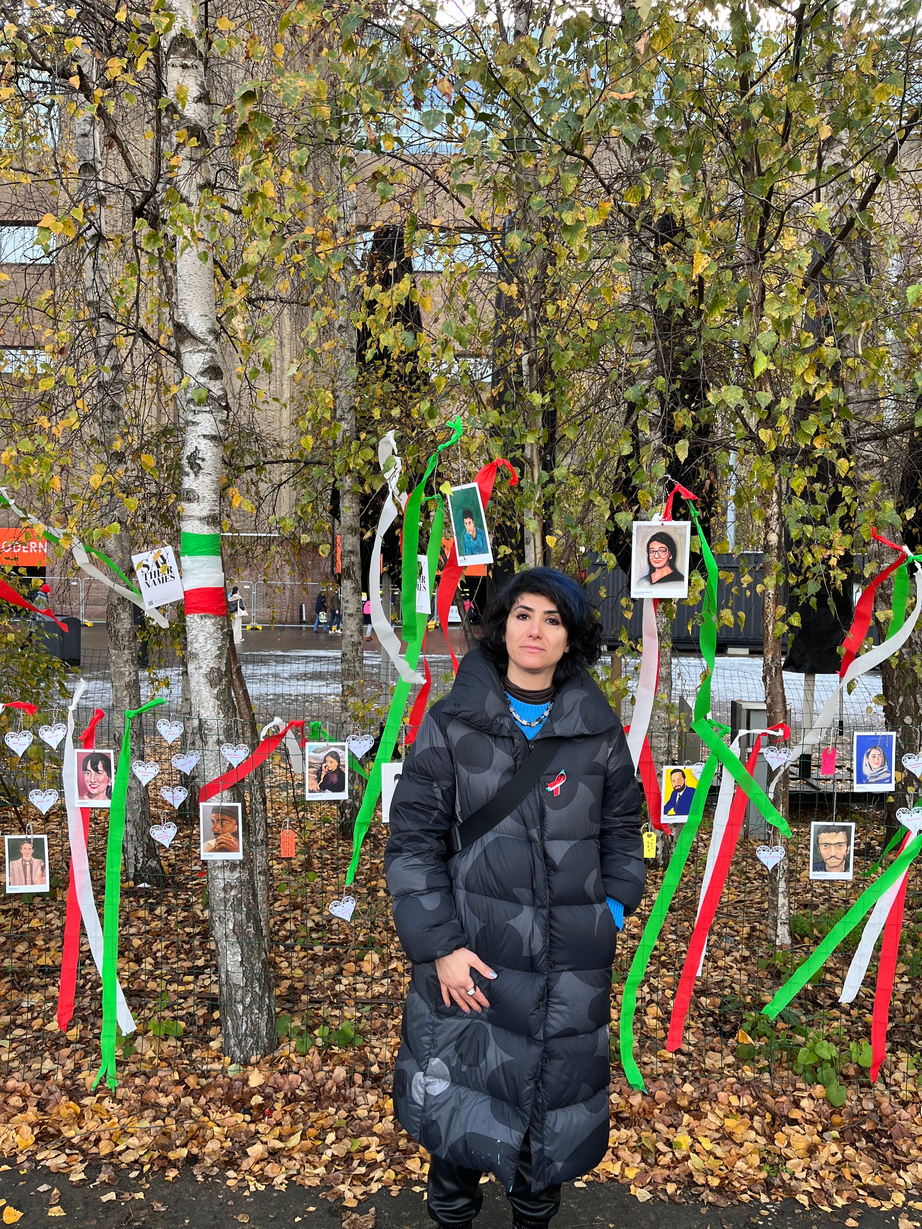 Iranian artist Anahita Rezvani-Rad in front of her work Say Their Names installed outside Tate Modern 

Photo: Louisa Buck