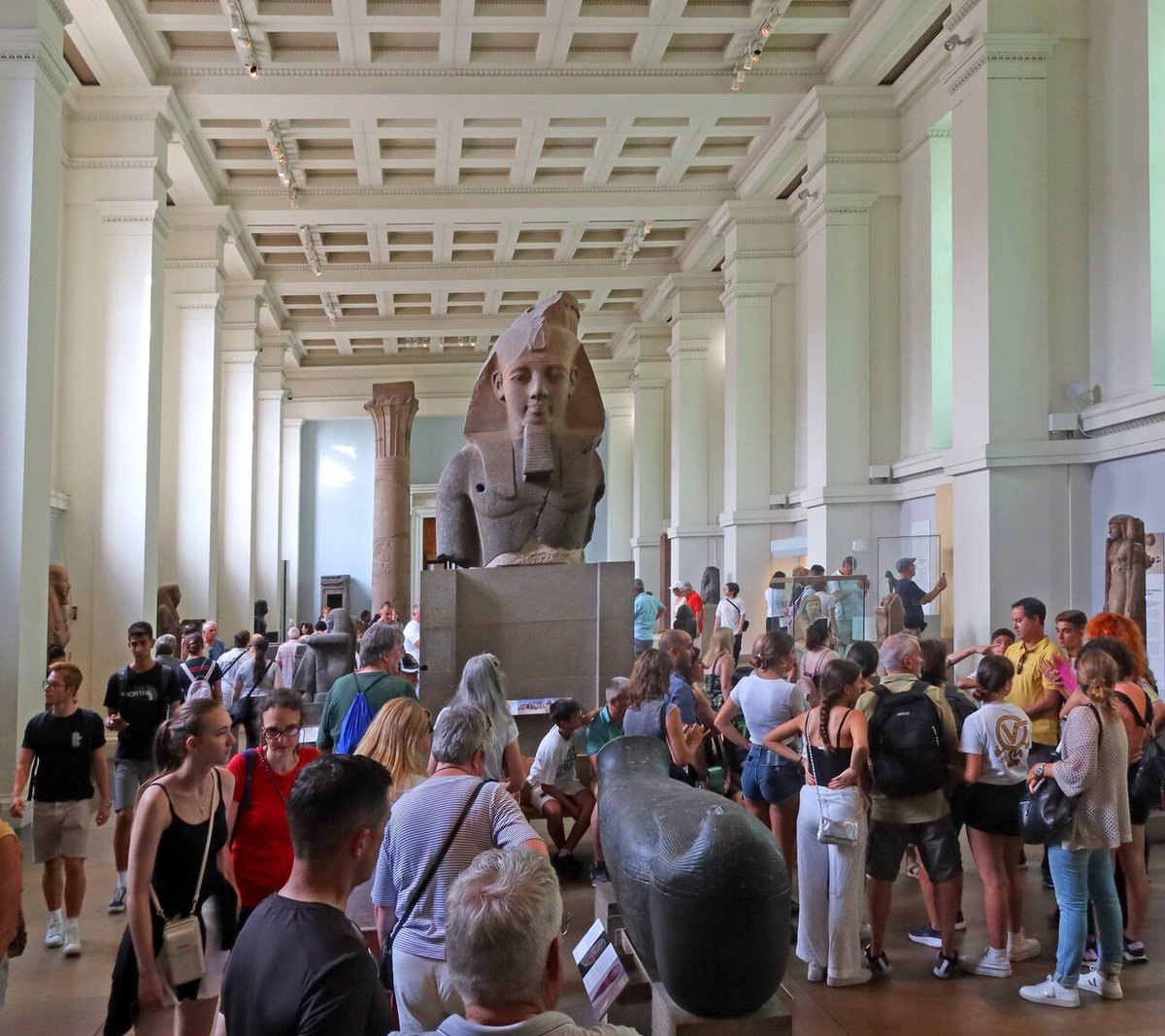 Visitors in the Ancient Egypt room viewing the granite head of King Amenhotep III at the British Museum Credit: Tony Smith / Alamy Stock Photo. Portrait: © Garry J. Shaw