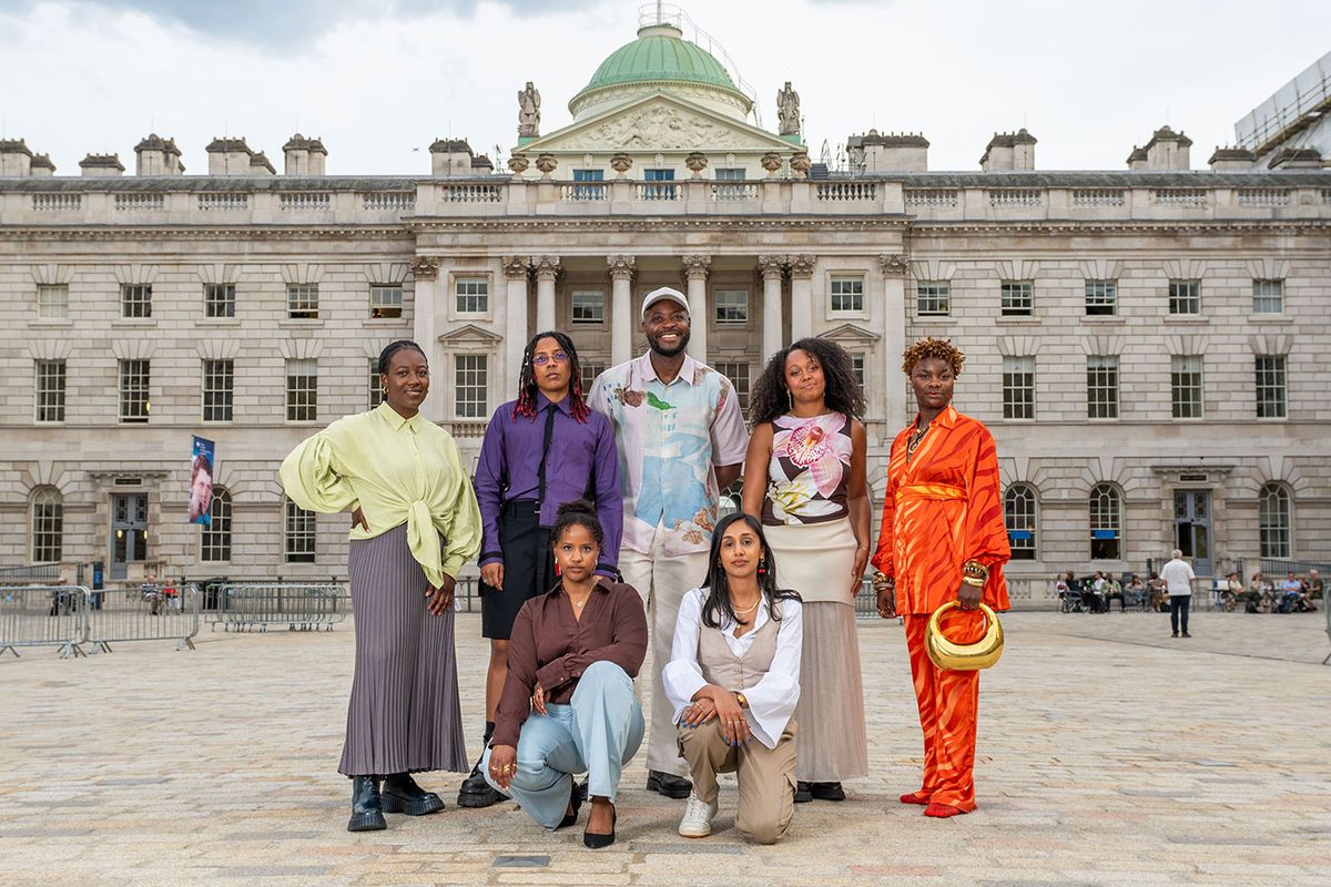 'It's a place where magic can happen': Yinka Ilori (back row centre) in the courtyard of Somerset House, London, with (from left standing) Piarvé Wetshi, enorê, Shanti Bell and Tyreis Holder. Kneeling front are Arda Awais  and Savena Surana of Identity 2.0 creative studio Photo: Jas Lehal/PA Media Assignments
