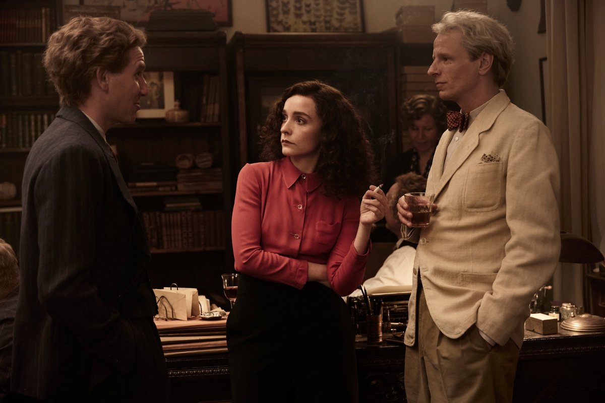 Still from Leonora in the Morning Light with Leonora Carrington (Olivia Vinall) with André Breton (Denis Eyriey) and Max Ernst (Alexander Scheer) © Luna Zscharnt, Dragonfly Films, Alamode Films