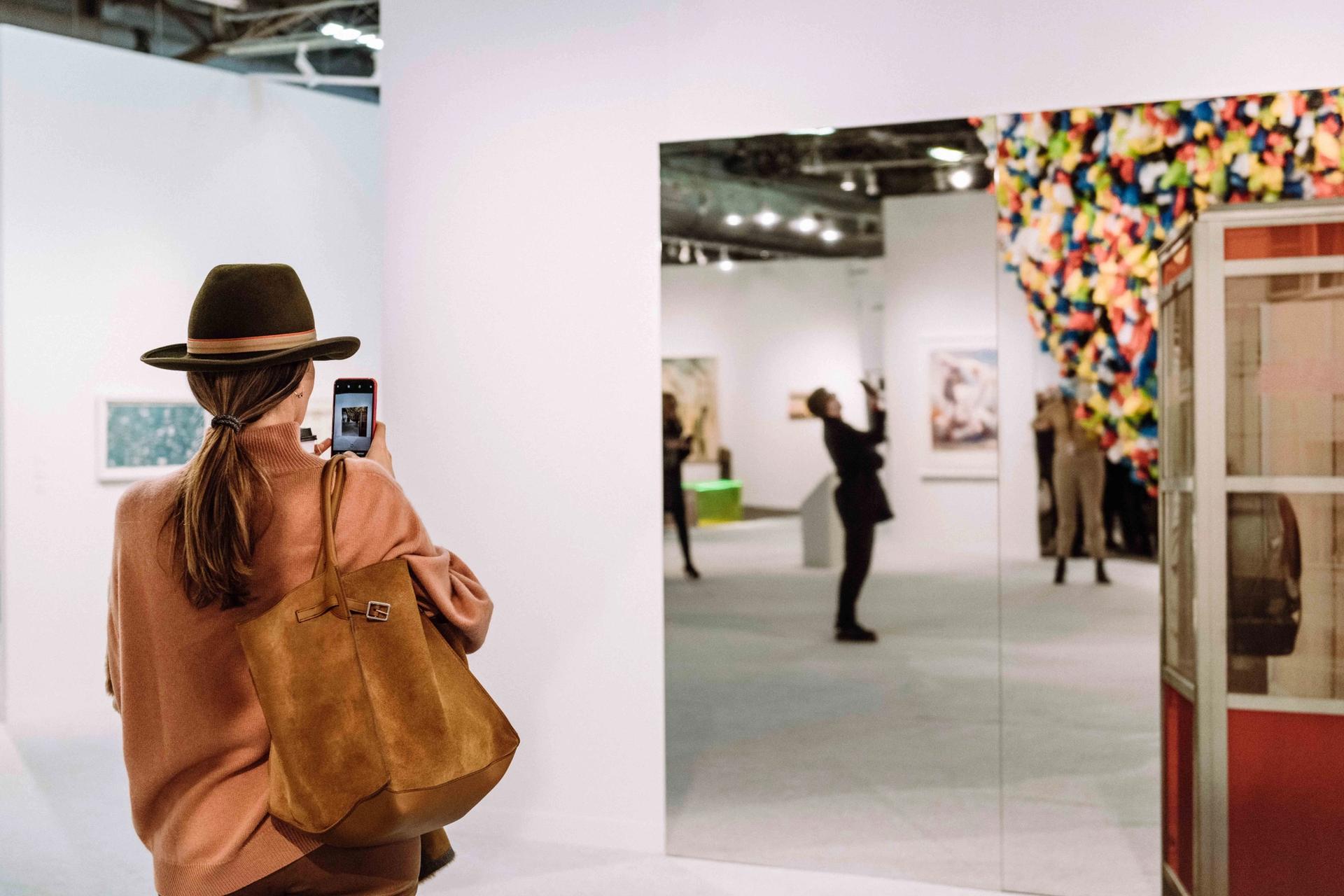 Taking advantage of shiny things and selfie opportunities at the Armory Show Photo by Teddy Wolff. Courtesy of the Armory Show