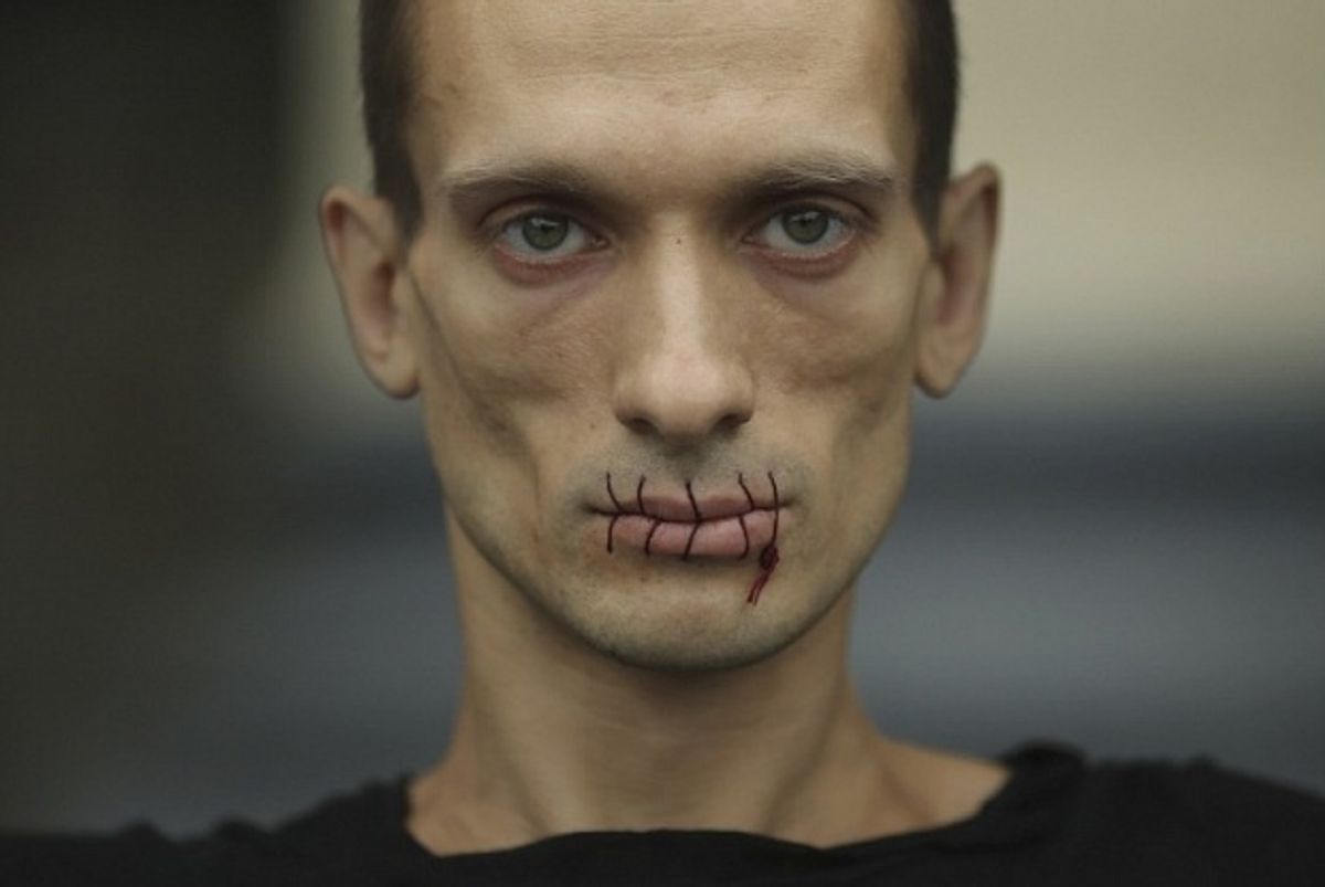 In one of his earliest performances in 2012, Pavlensky sewed his lips shut in protest against the jailing of members of the feminist punk band Pussy Riot 