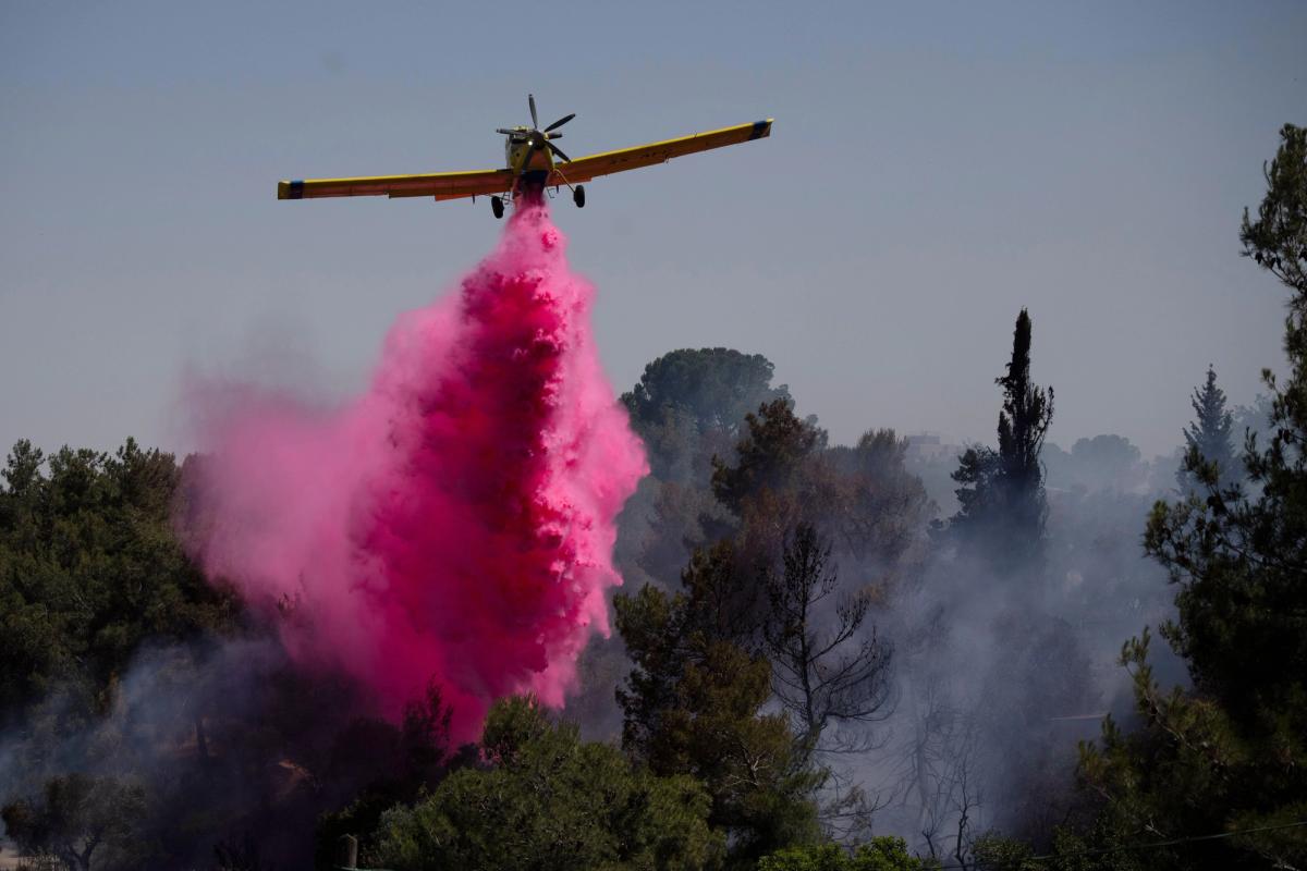 A plane uses a fire retardant to extinguish the fire on Sunday 2 June 2024
Associated Press / Alamy Stock Photo