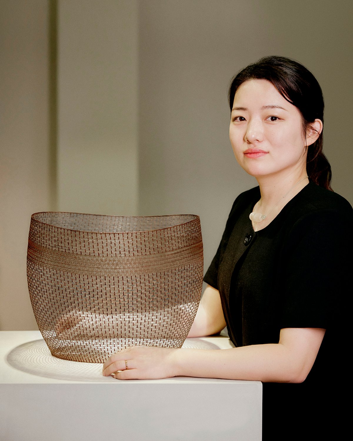 Korean weaver Dahye Jeong with her prize-winning work A Time of Sincerity (2021)