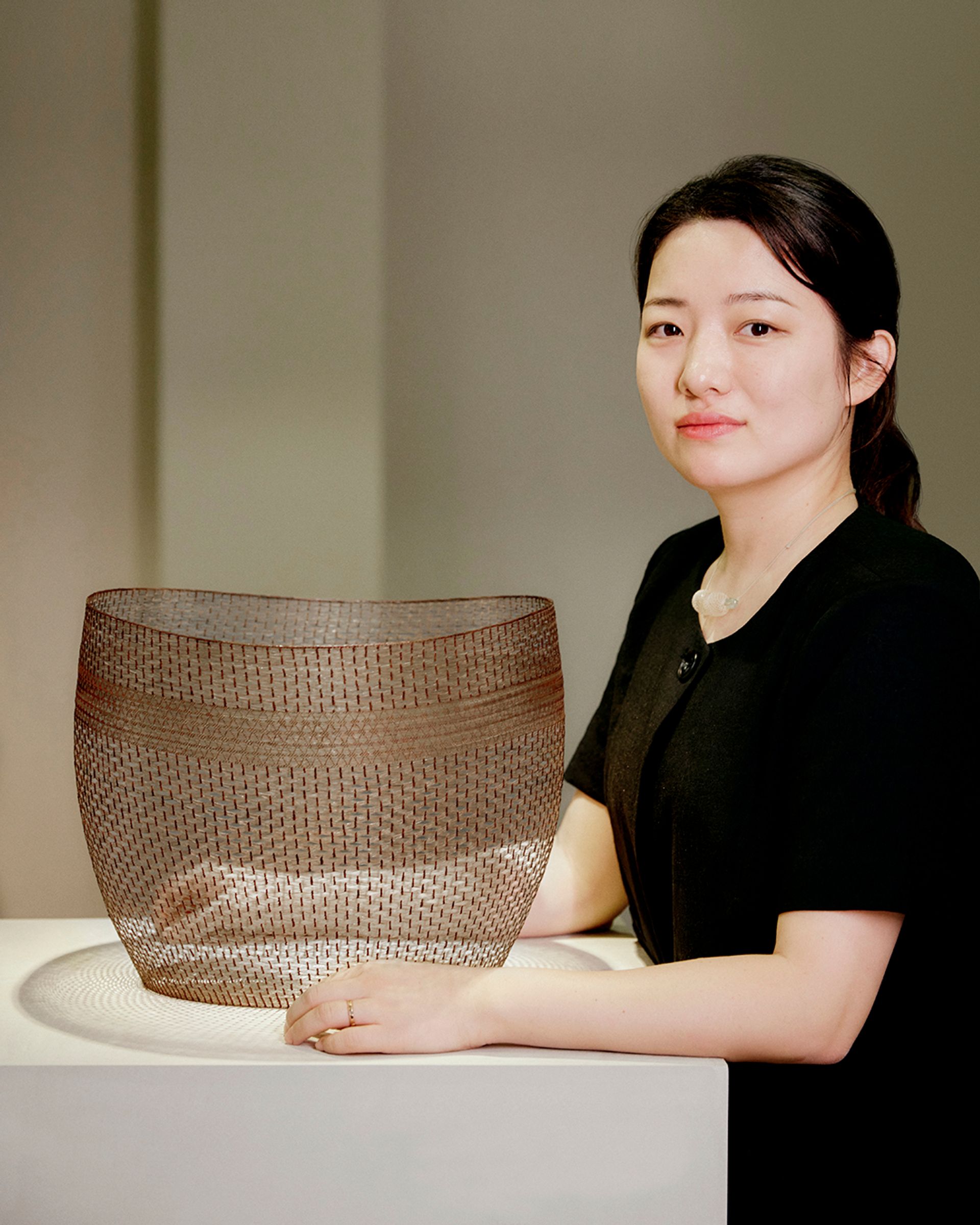 Korean weaver Dahye Jeong with her prize-winning work A Time of Sincerity (2021)