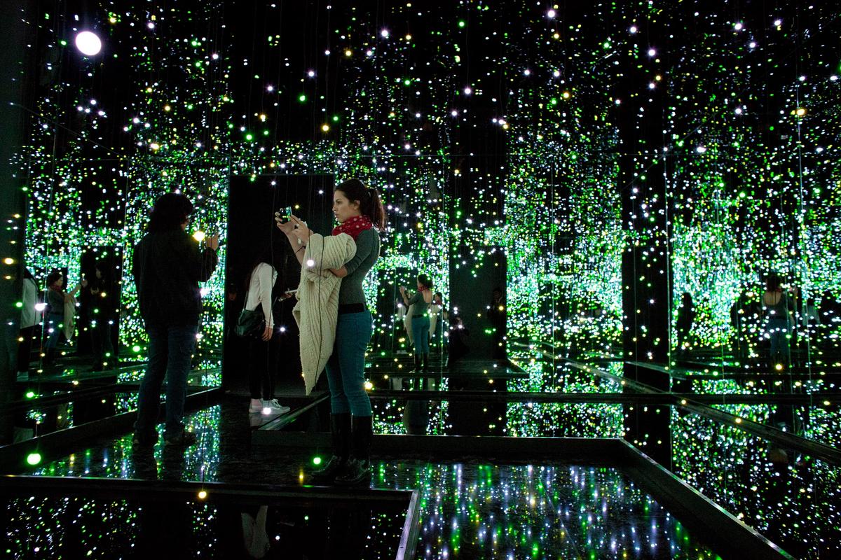 Visitors take pictures inside one of Yayoi Kusama Infinity Mirrored Rooms at the Rufino Tamayo Museum in Mexico City AP Photo/Rebecca Blackwell
