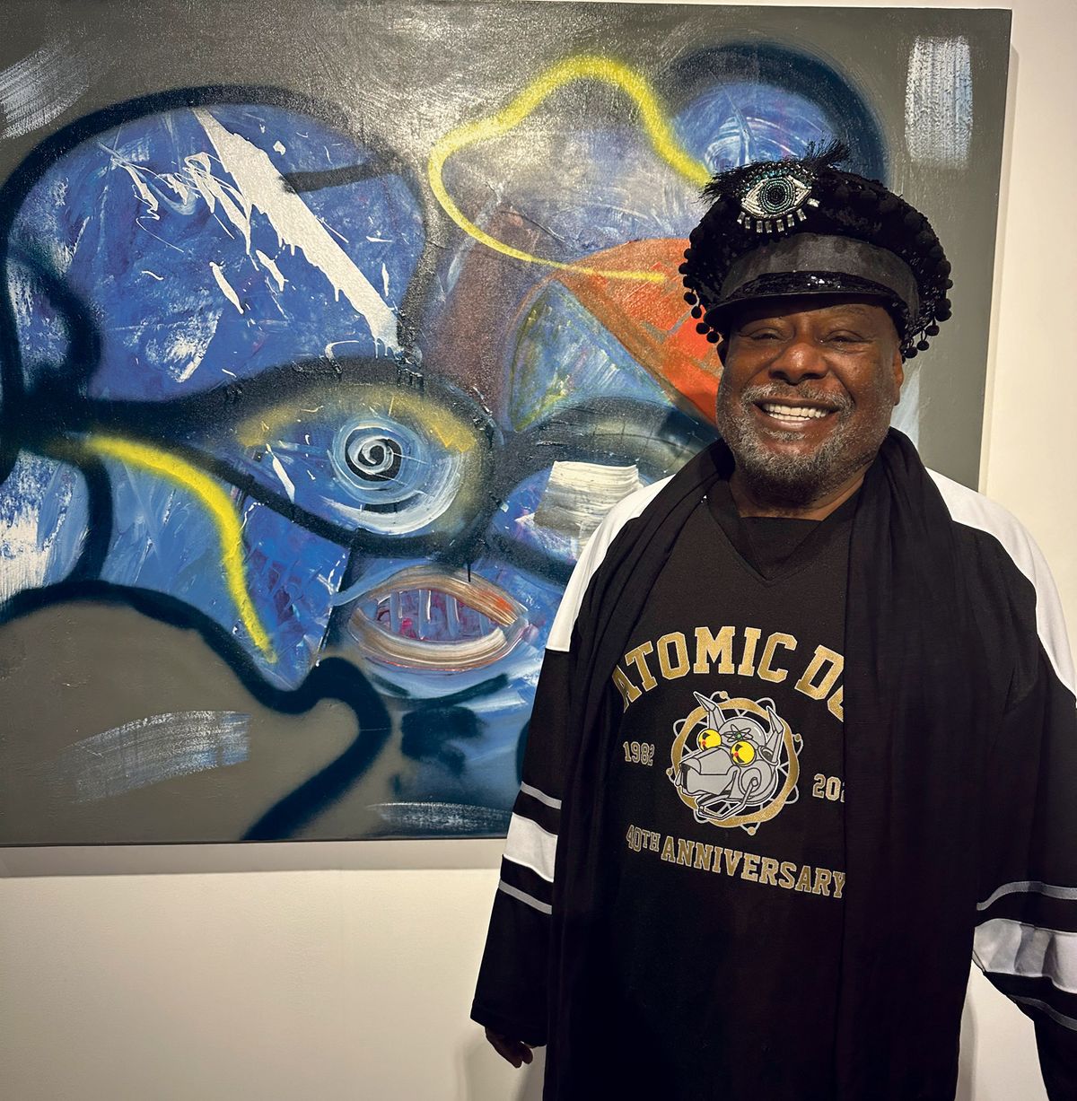 Reasons to be cheerful: George Clinton in front of his work Evolutionary Directory: Which way do you want to be “what”? at Jeffrey Deitch’s stand. Theartist posed for selfies at the fair and reminisced about his time in Miami as a young man