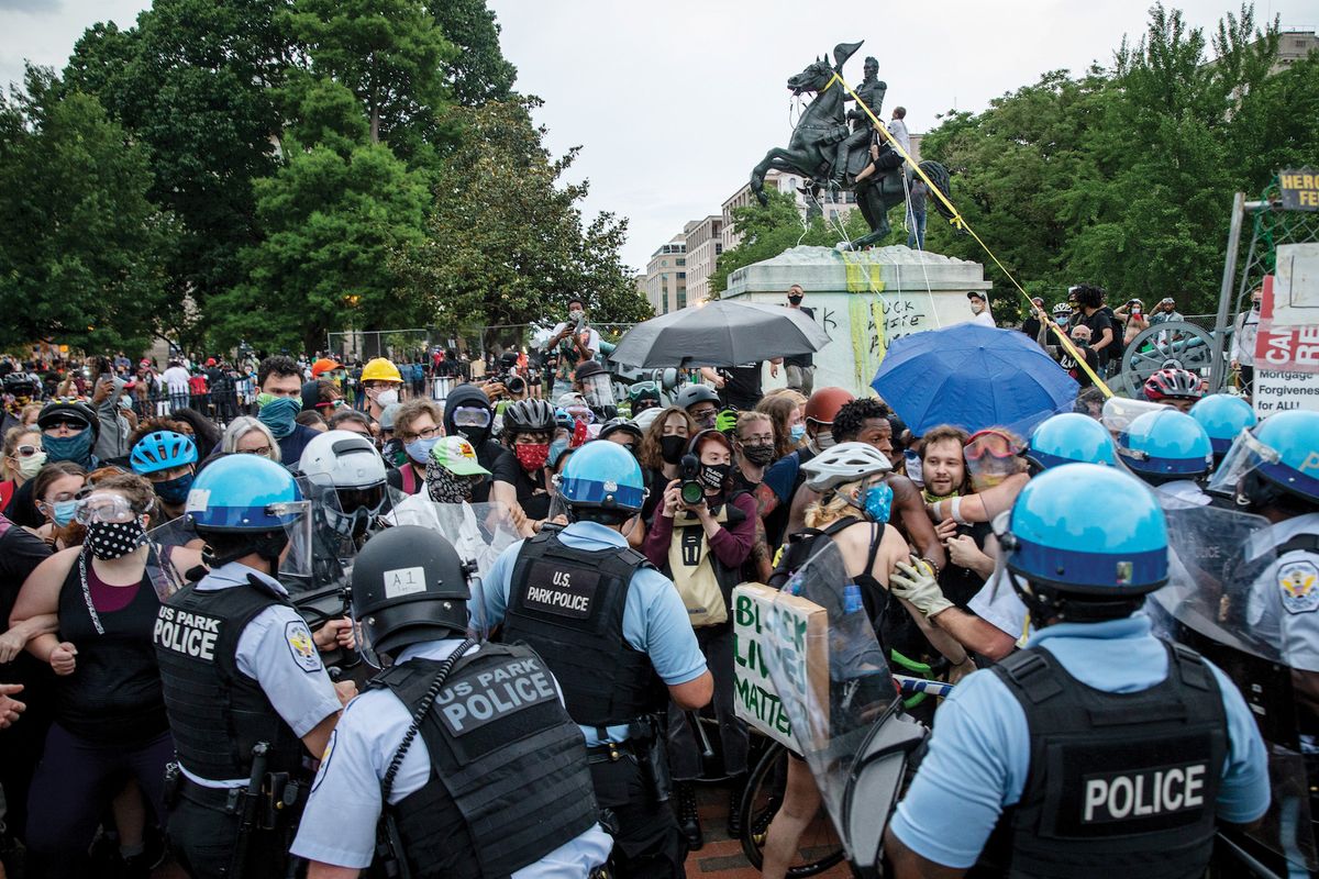 US Park Police clash with protesters attempting to pull down a statue of President Andrew Jackson in Lafayette Square near the White House in Washington, DC on 22 June Tasos Katopodis /Getty Images
