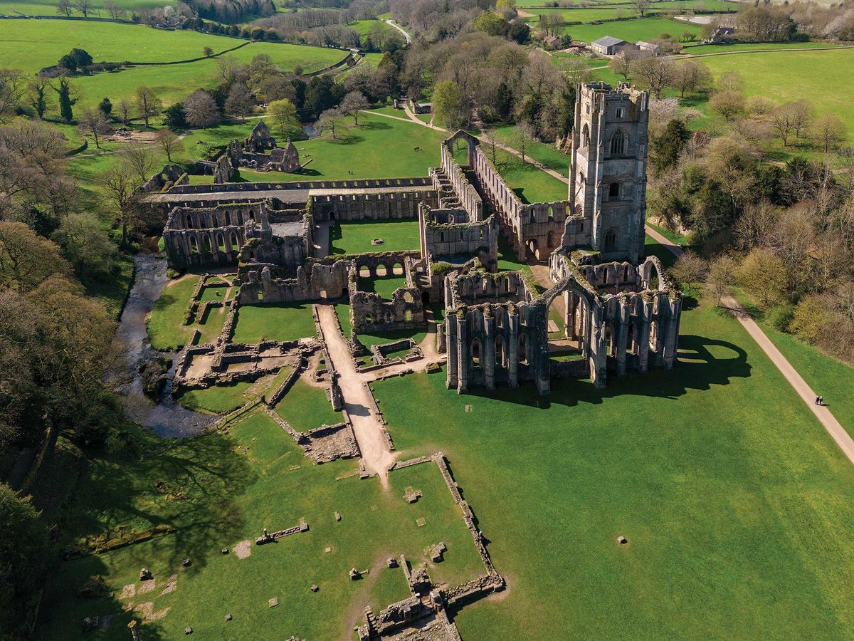 Secular pilgrimage: hundreds of thousands of visitors each year flock to the spectacular ruins of Fountains Abbey Photo © Steve Allen