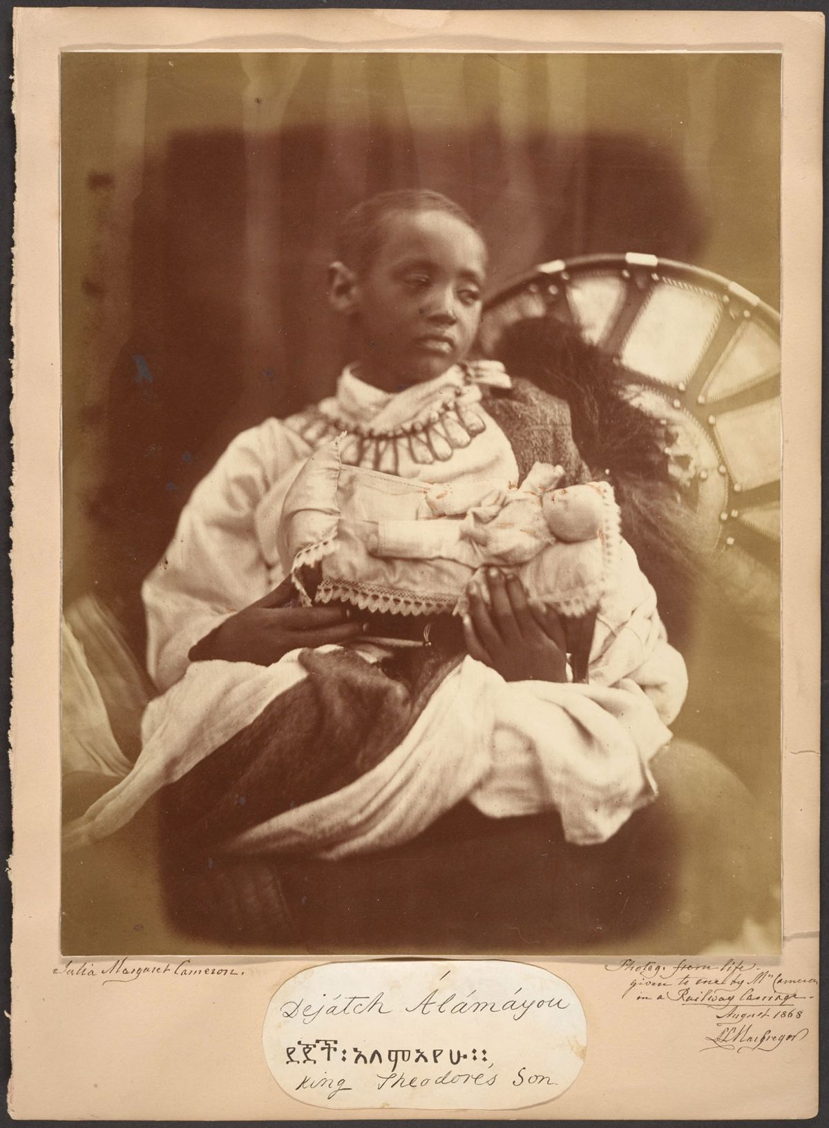 Julia Margaret Cameron's photograph of Déjatch Alámayou, the son of King Theodore who committed suicide after the British defeat of the Ethiopians at the battle of Magdala. He was taken to England where Queen Victoria saw to his education and protection. He was buried at Windsor Castle when he died of pleurisy aged 18. Wikimedia commons