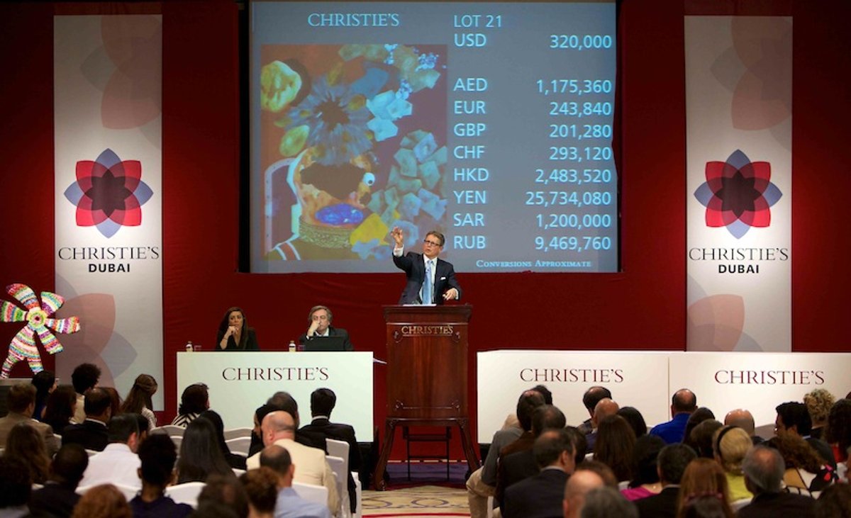 Auctioneer Jussi Pylkkänen on the rostrum at Christie's Dubai sale in 2012 Courtesy of Christie's