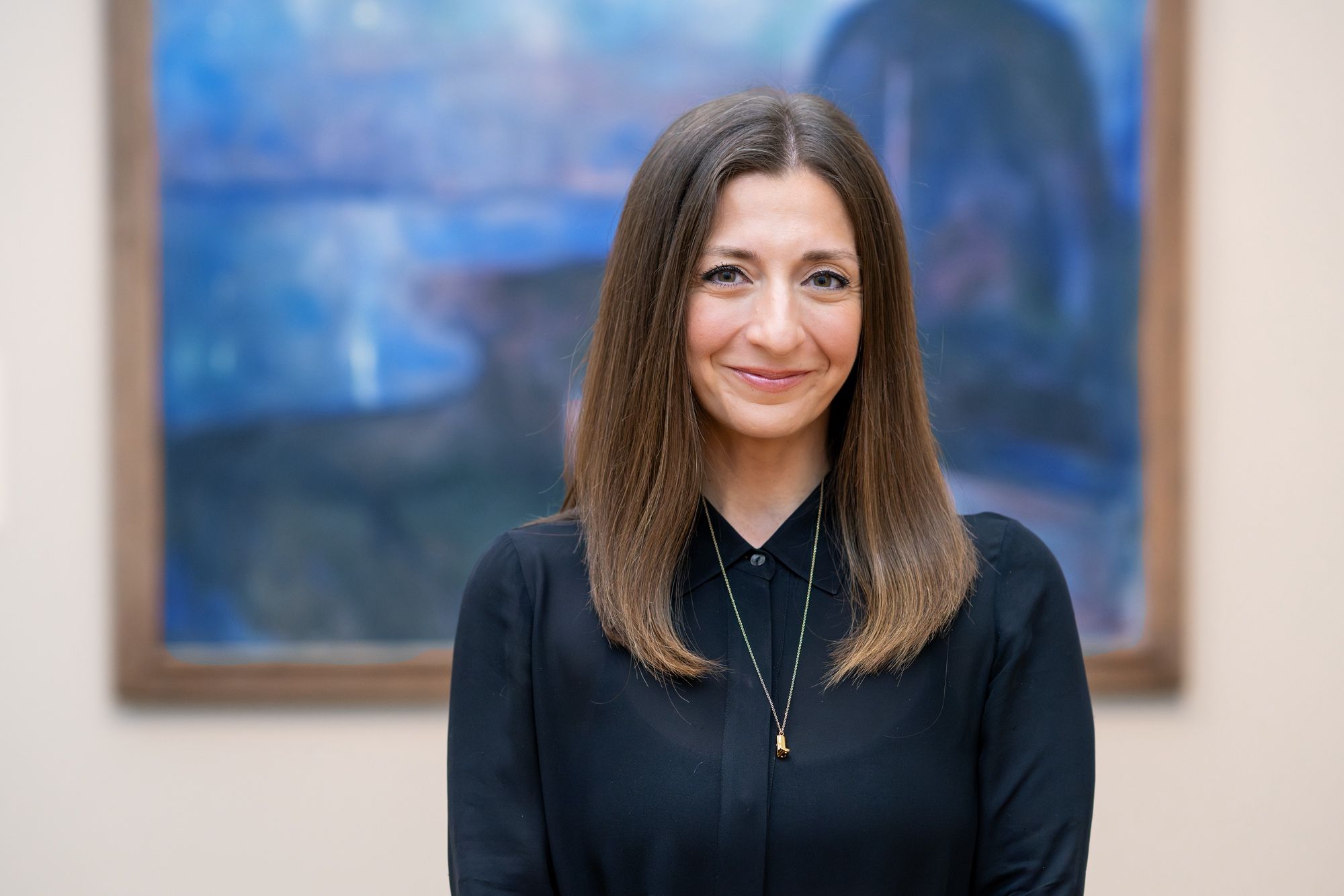 Lilit Sadoyan, a gallery educator at Getty and the host of the new podcast Our Museum Mindfulness Meditation (Ommm), in front of Edvard Munch's Starry Night (1893), featured in the podcast's third episode Photo by Karen Du. © 2025 J. Paul Getty Trust