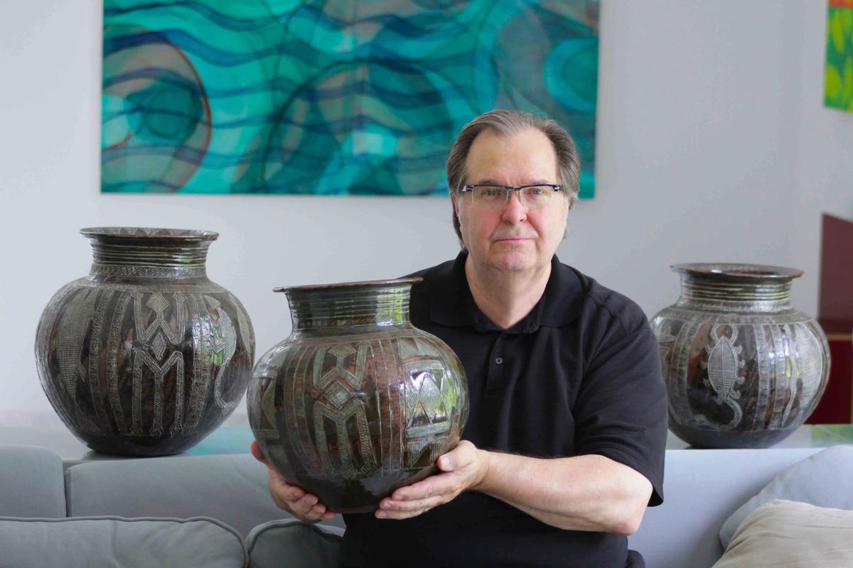 John Driscoll, with a pot by Ladi Kwali

Photo: Emily Driscoll