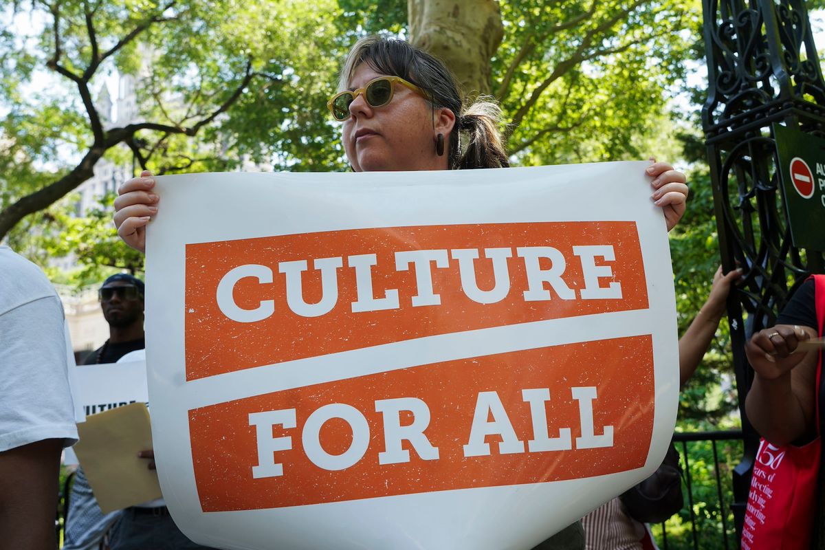 A participant during last month's rally outside New York City Hall to protest cuts to municipal arts funding Photo Credit: Gerardo Romo / NYC Council Media Unit.