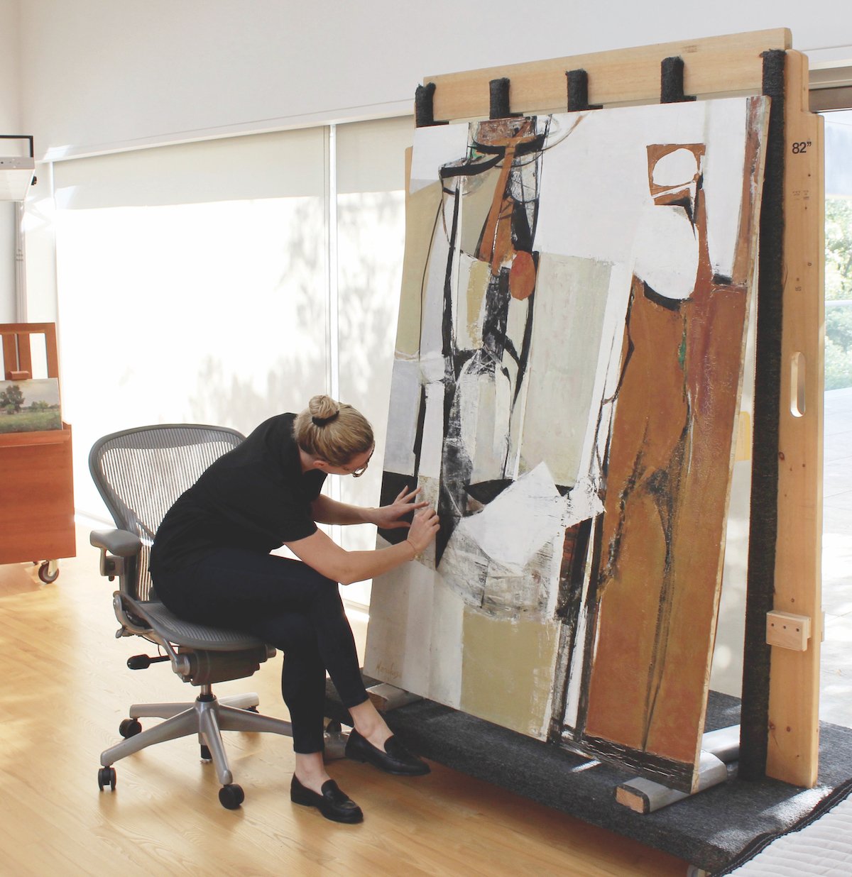 A conservator examines the damaged Stoic Figure (1959) by Maria Louisa Pacheco ahead of restoration Laura Eva Hartman, Dallas Museum of Art