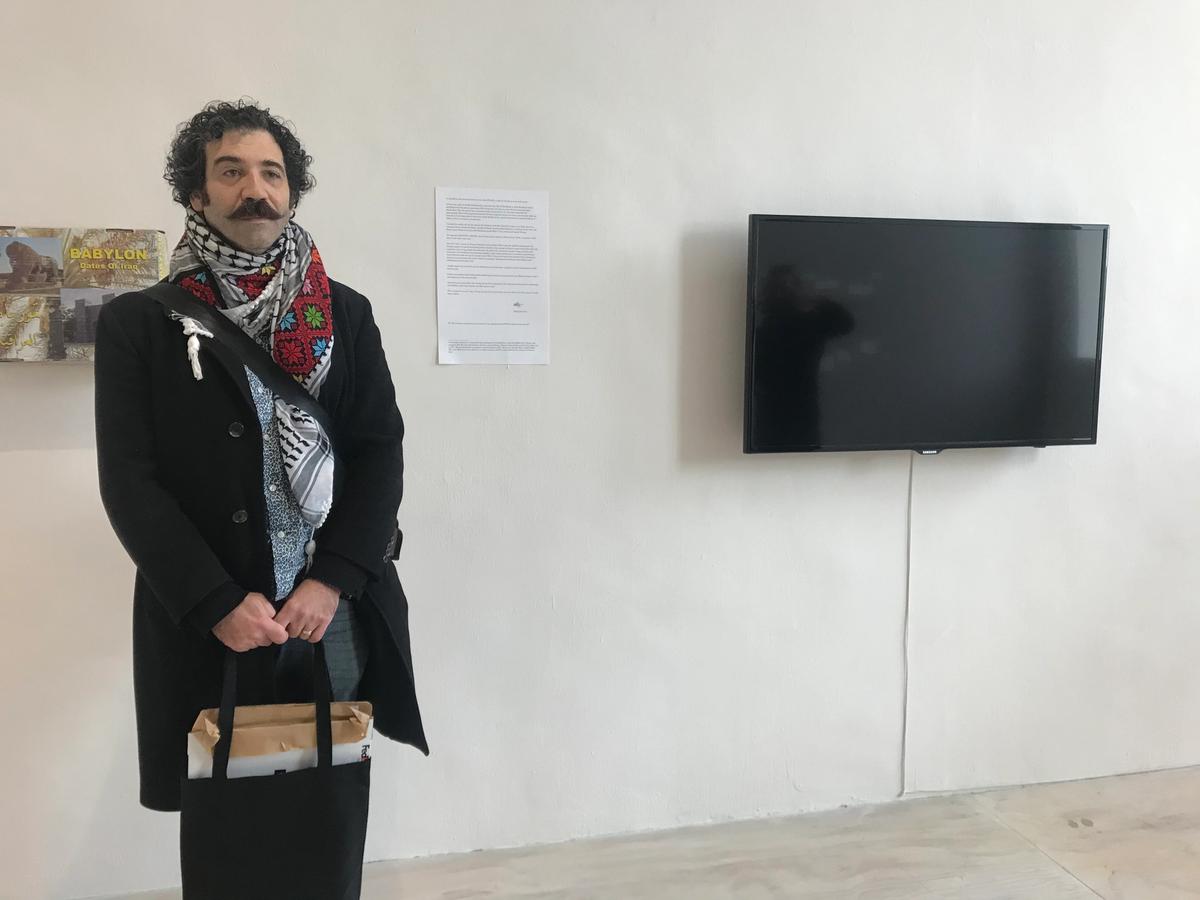 Michael Rakowitz in front of his video installation RETURN (2004–) at MoMA PS1. Photo: Jillian Steinhauer